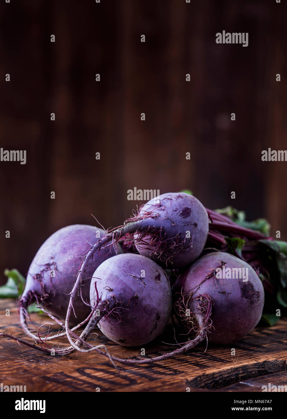 Raw beetroot bunch on a wooden surface Stock Photo