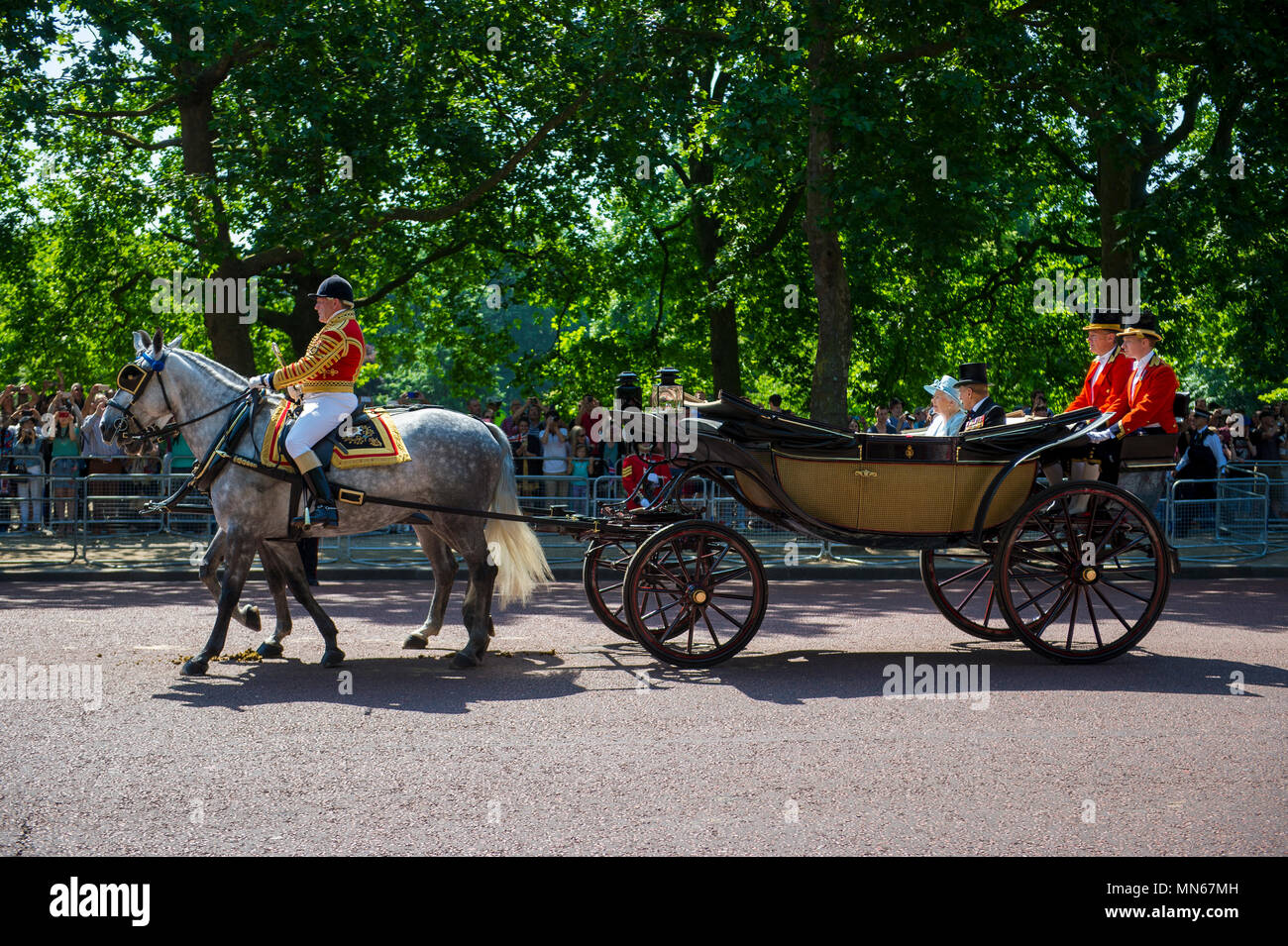 LONDON, UK - JUNE 17, 2017: Her Majesty Queen Elizabeth II and Duke of Edinburgh travel by horse drawn carriage during the Trooping the Colour parade. Stock Photo