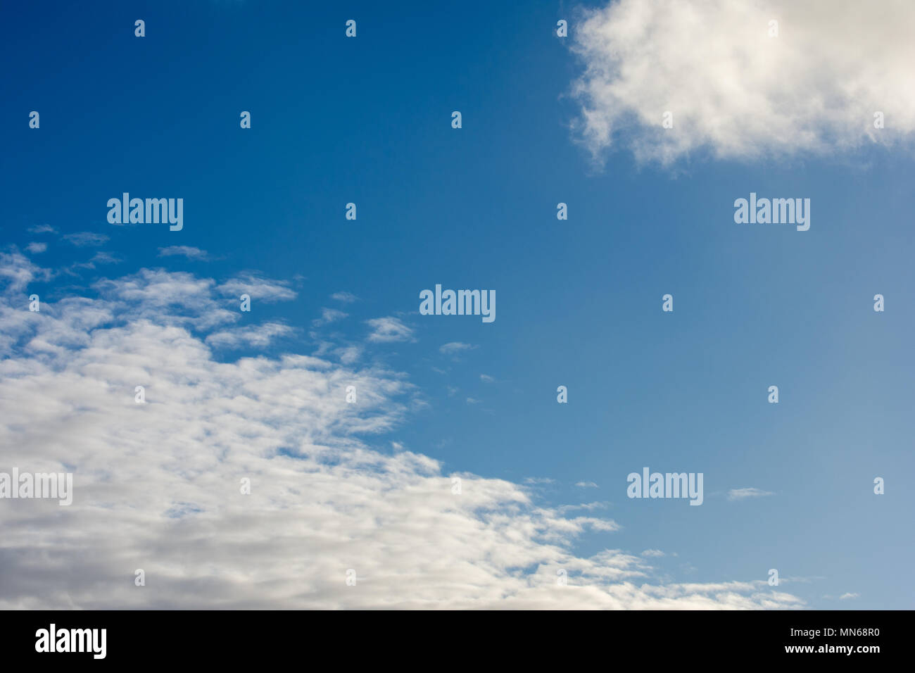 Sun against blue sky and white cumulus clouds hi-res stock photography ...