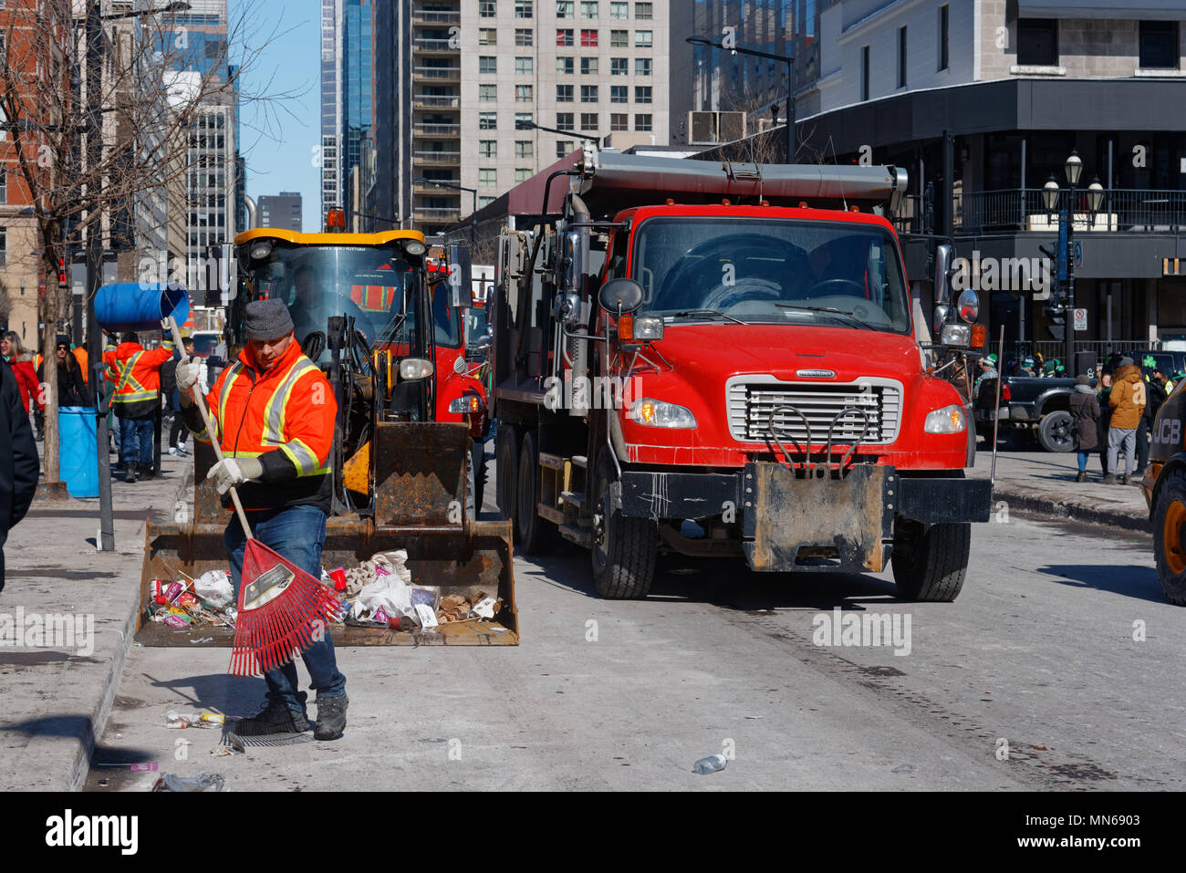 Street cleaning team clearing up after the Montreal St Patricks Day parade Stock Photo