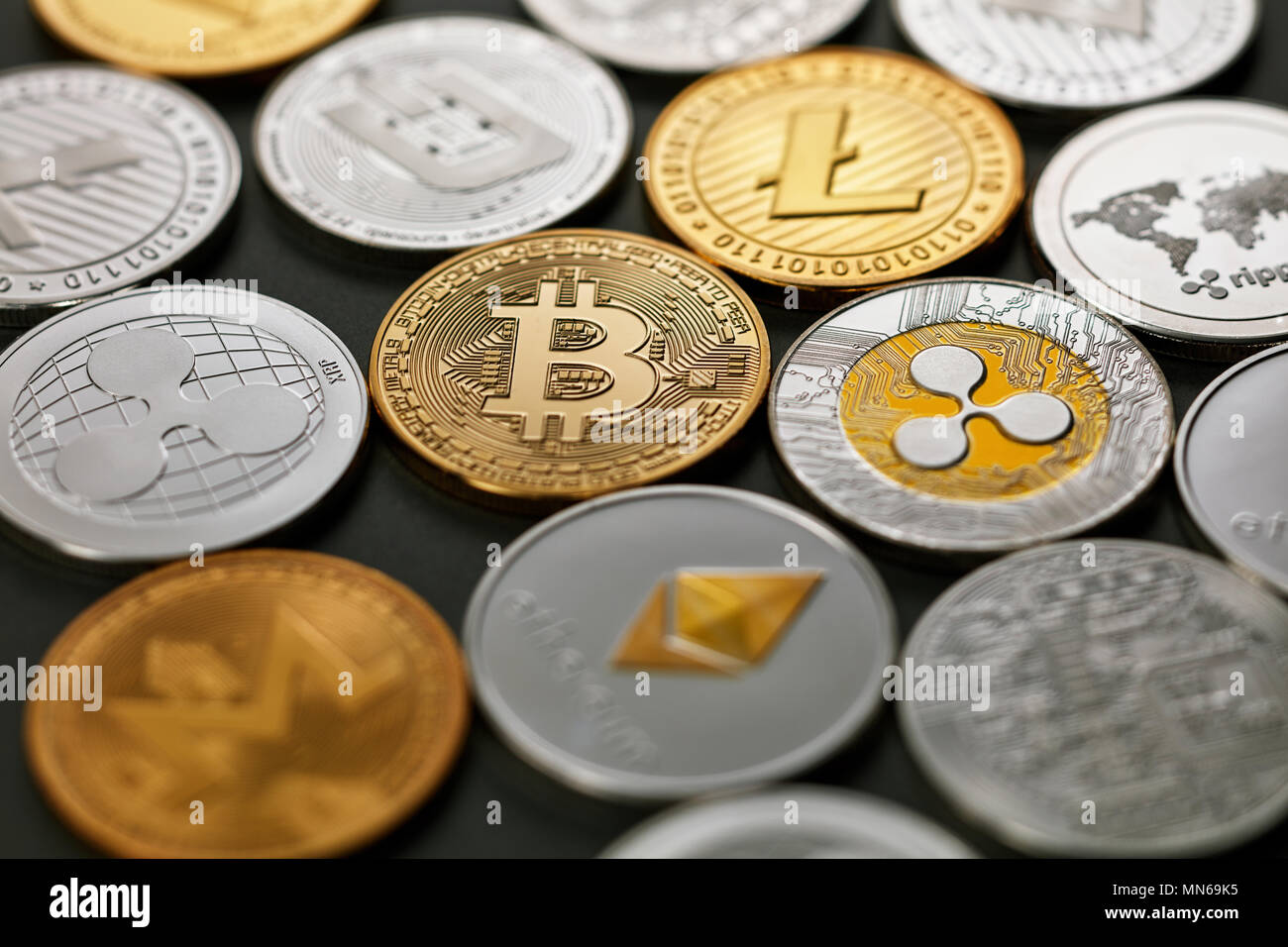 Pattern of coins LTC, ETH, BTC, XMR, XRP on a dark background. Business  concept Stock Photo - Alamy