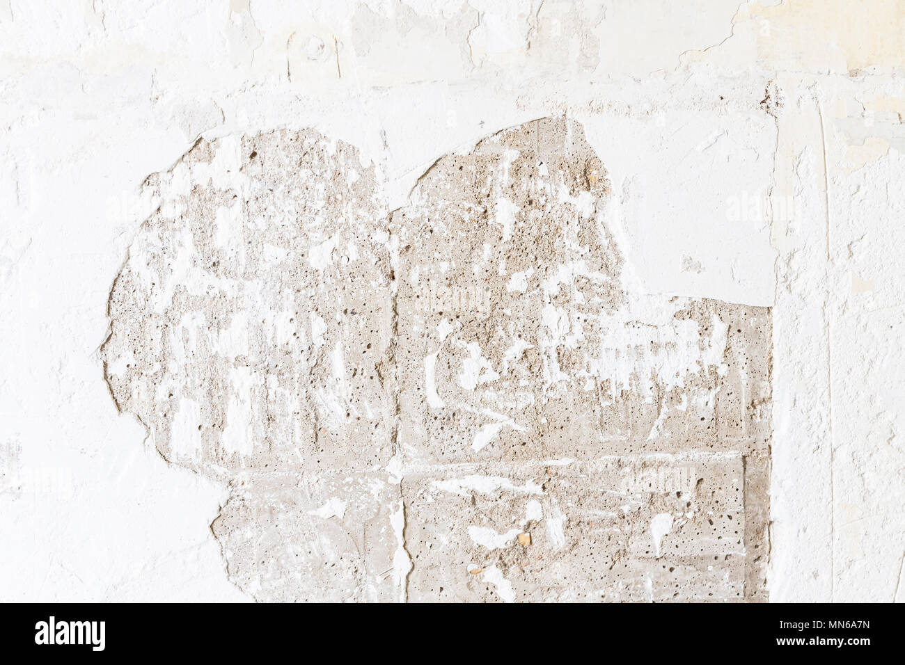 Textured ragged white wall plaster, after taking out tile. The wall ...