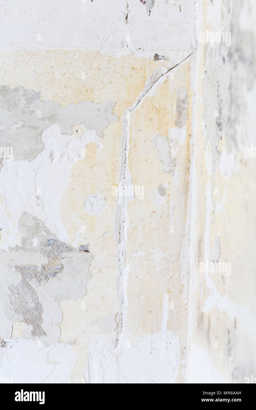 Textured ragged white wall plaster, after taking out tile. The wall ...