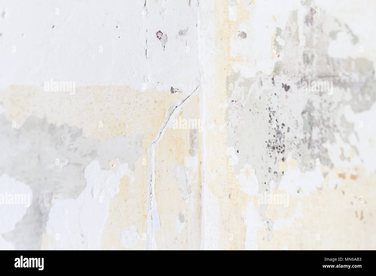 Textured ragged white wall plaster, after taking out tile. The wall ...