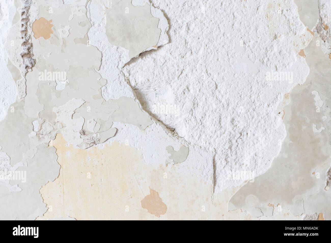 Textured ragged white wall plaster, after taking out tile. The wall ...
