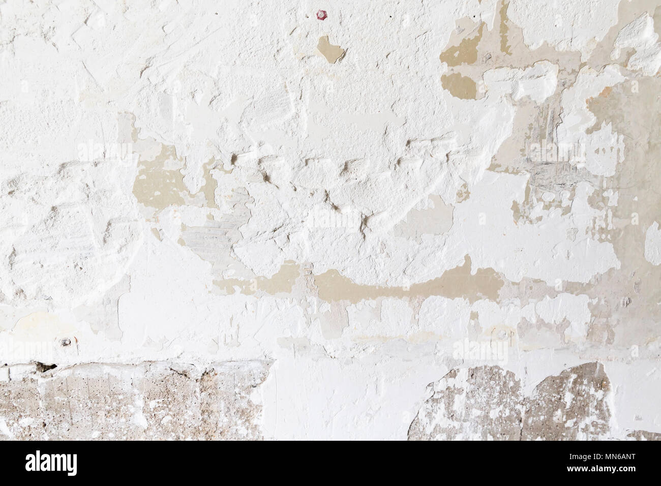 Textured ragged white wall plaster, after taking out tile. The wall ...