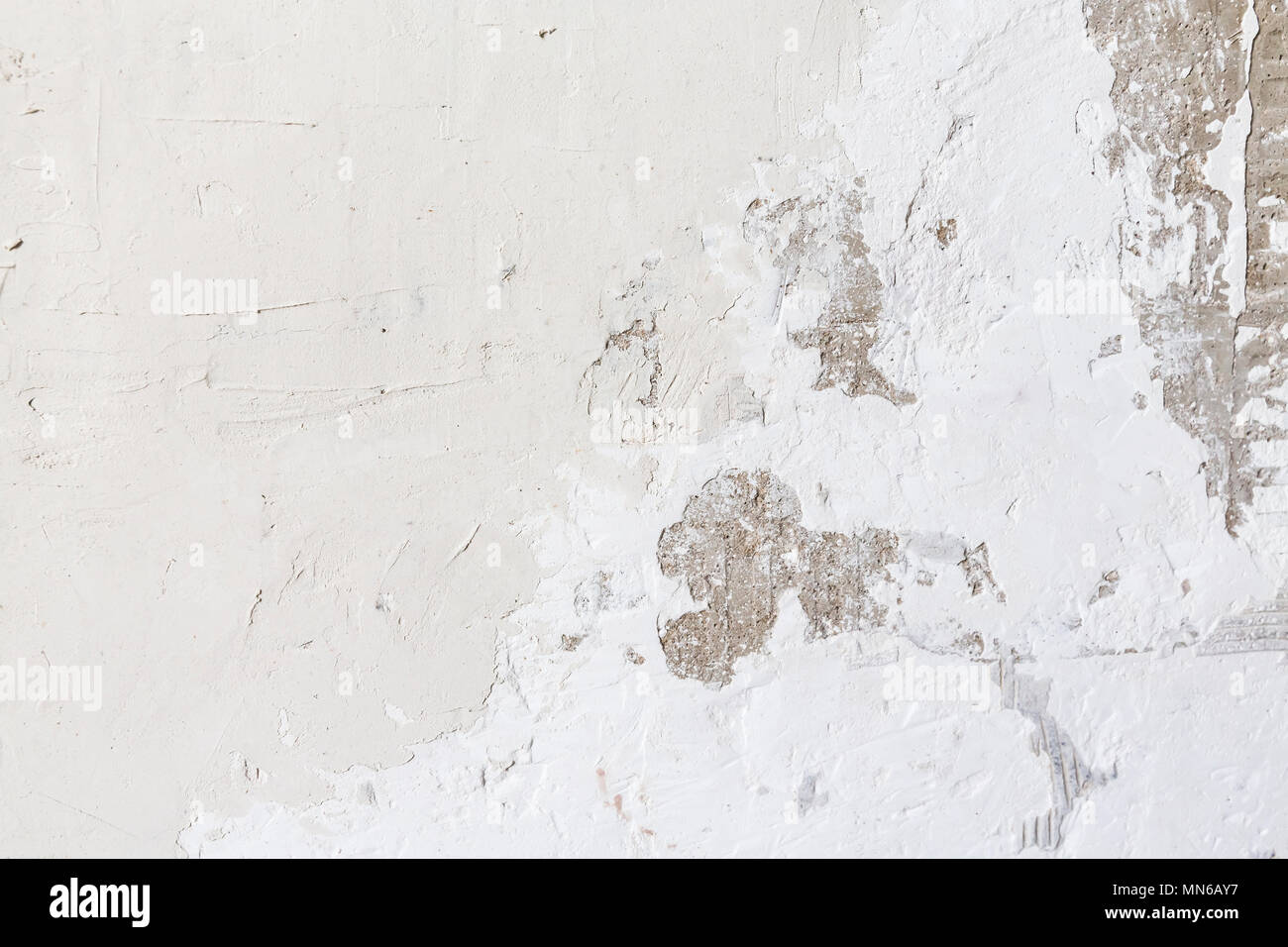 Textured ragged white wall plaster, after taking out tile. The wall ...