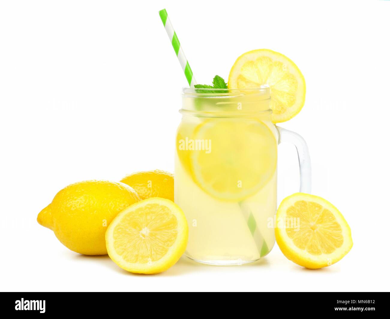Mason jar glass of lemonade with lemons and straw isolated on a white background Stock Photo