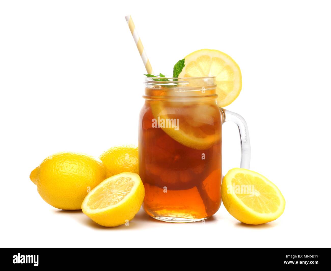 Mason jar glass of iced tea with lemons and straw isolated on a white background Stock Photo