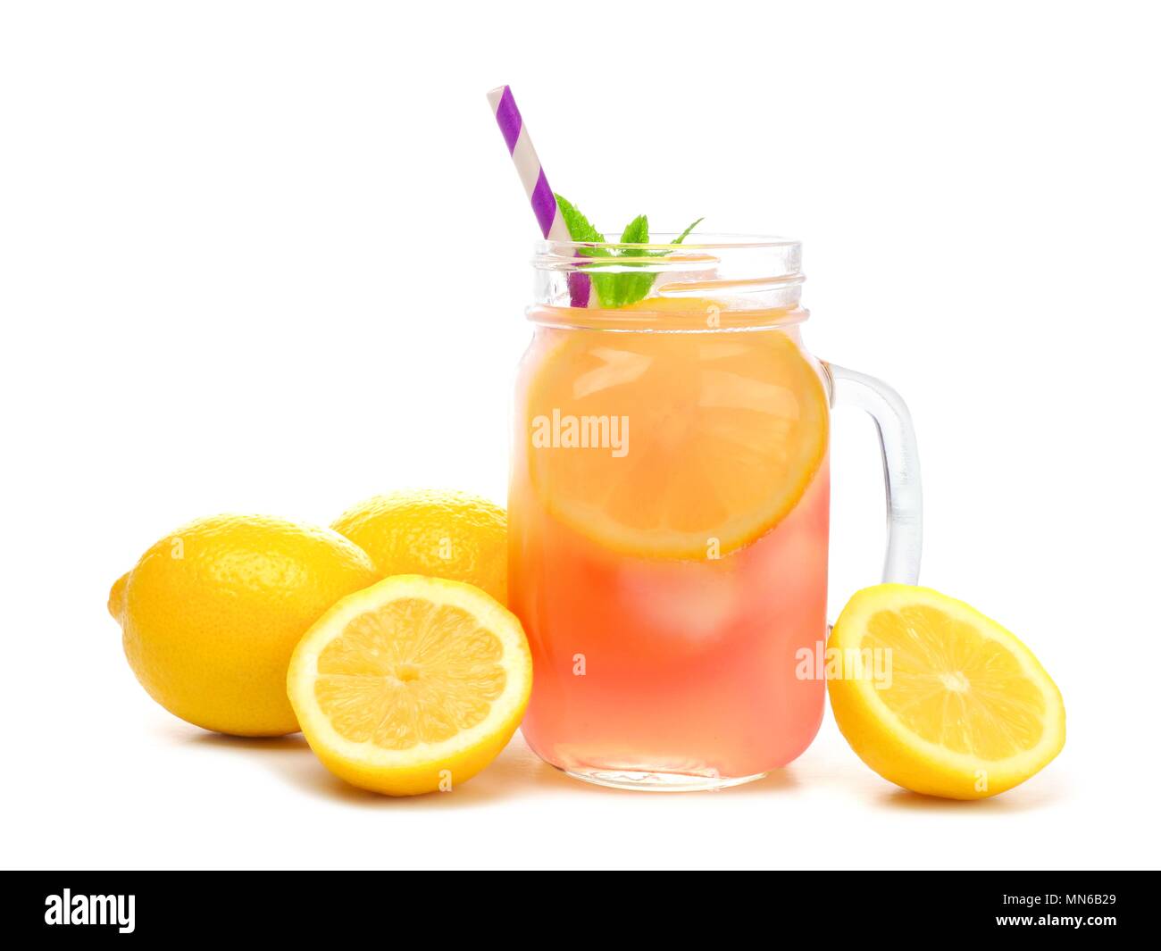 Mason jar glass of pink lemonade with lemons and straw isolated on a white background Stock Photo