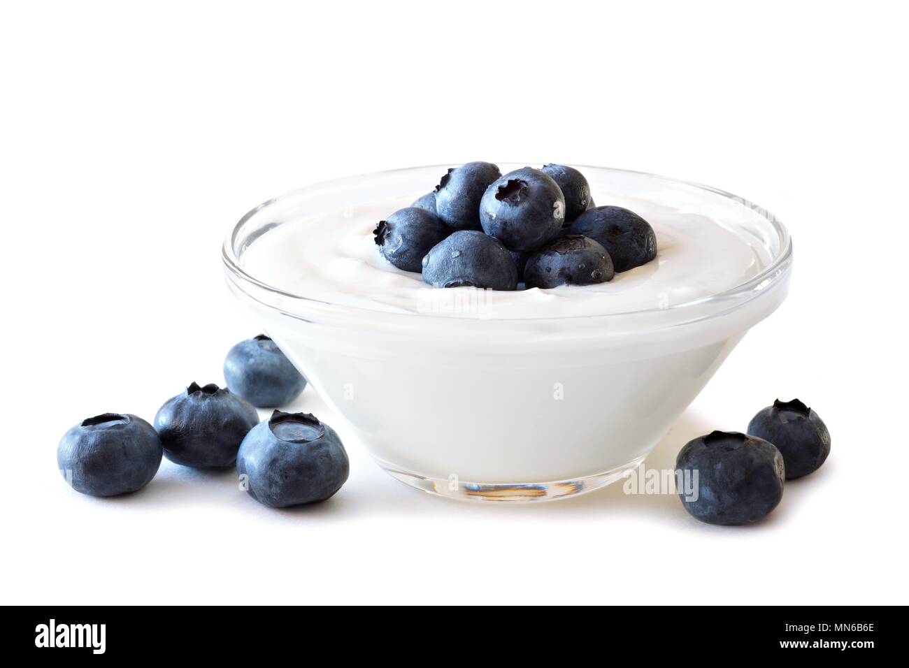 Clear bowl of yogurt with blueberries over a white background Stock Photo