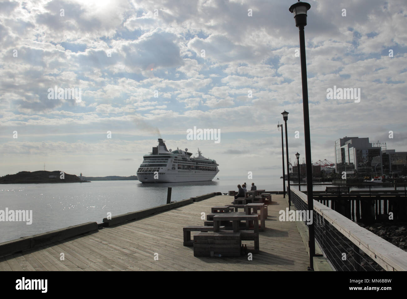 A cruise ship readys to dock in the busy tourism port of Halifax, N image