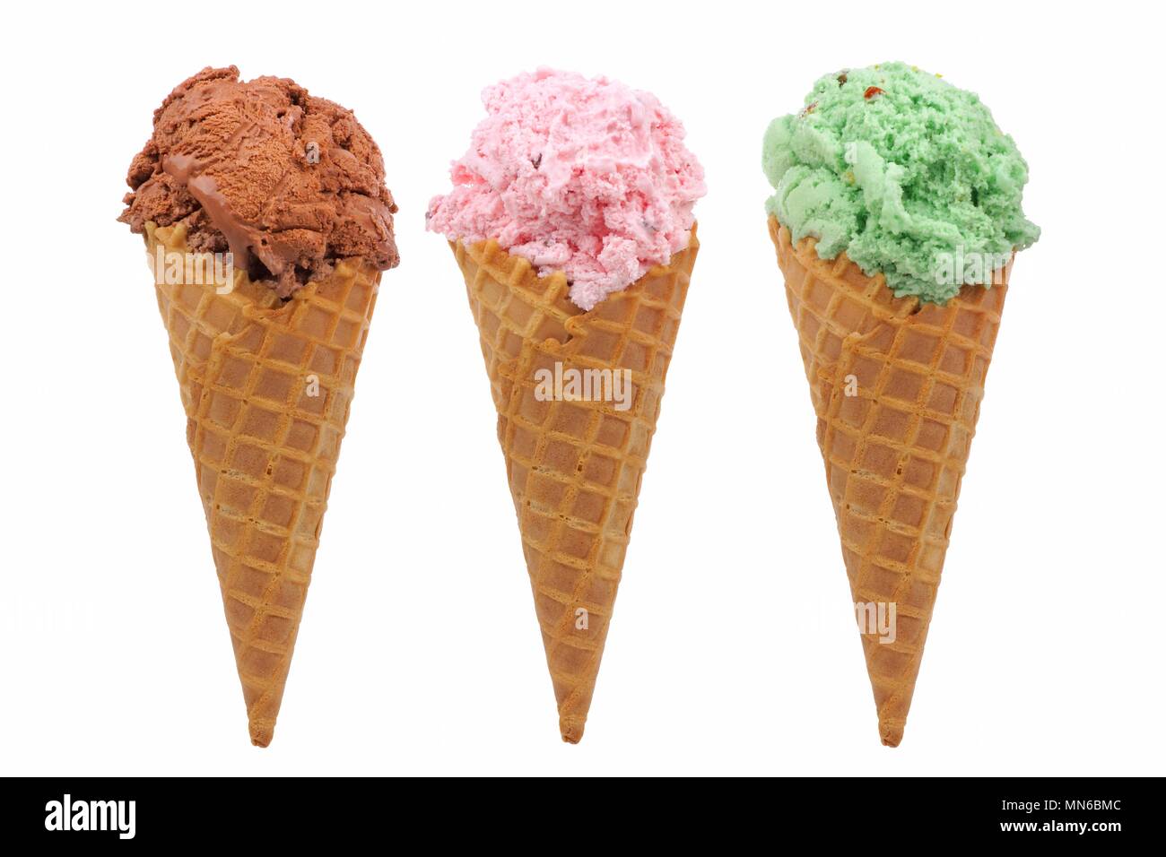 Chocolate, cherry and pistachio ice cream in waffle cones isolated on a