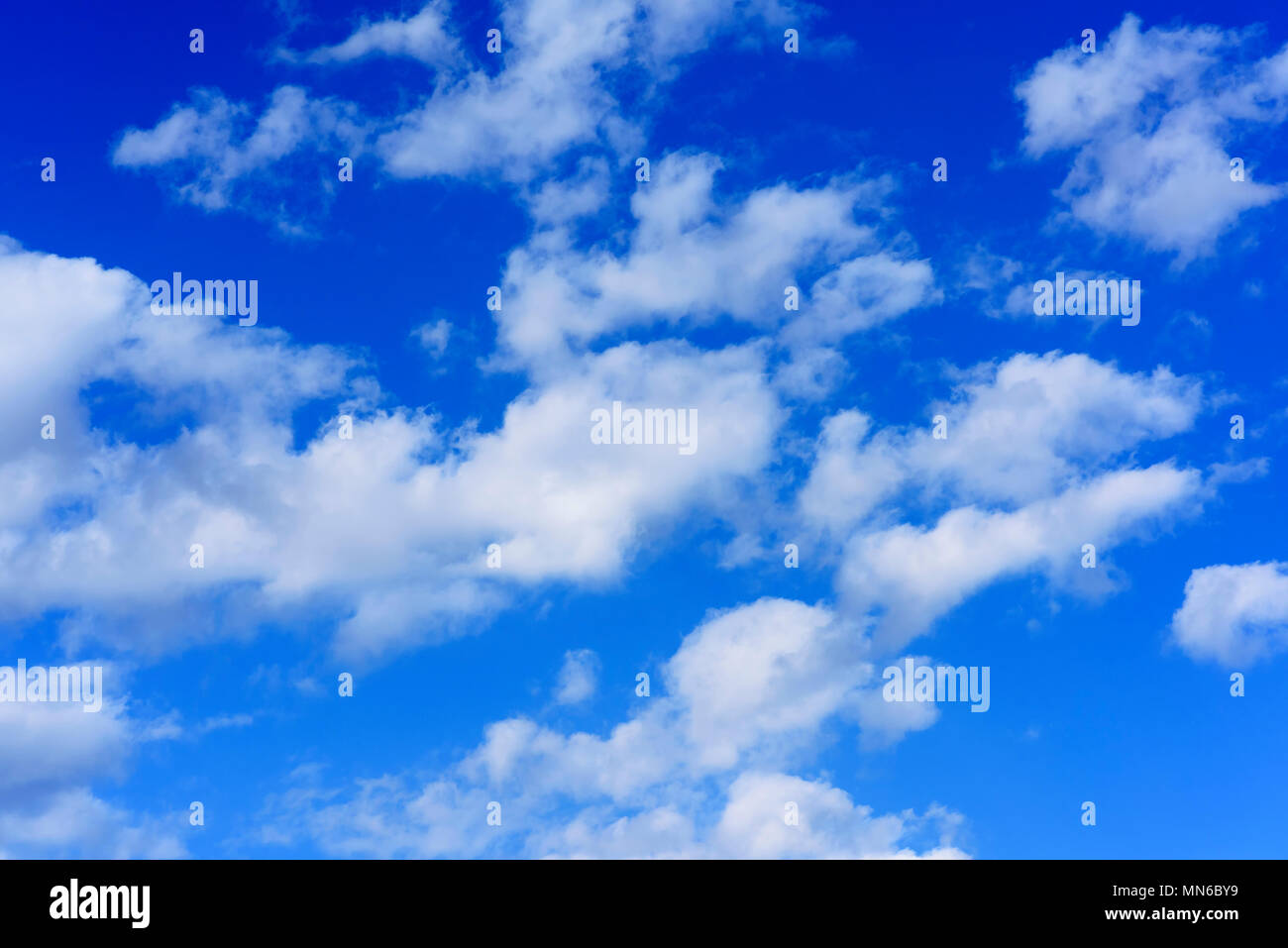 blue sky with white fluffy clouds on a summer day Stock Photo - Alamy