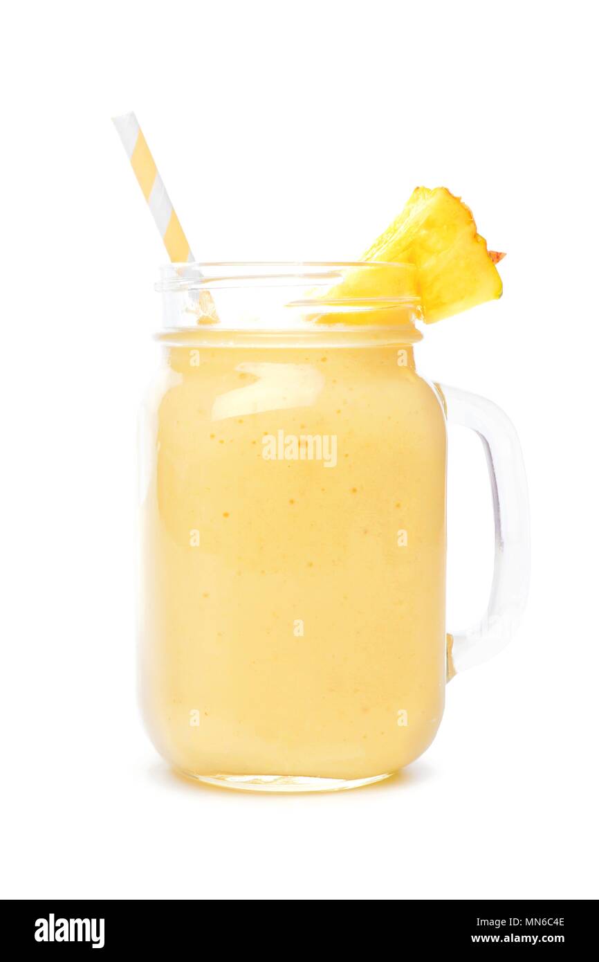 Pineapple smoothie in a mason jar with straw isolated on a white background Stock Photo
