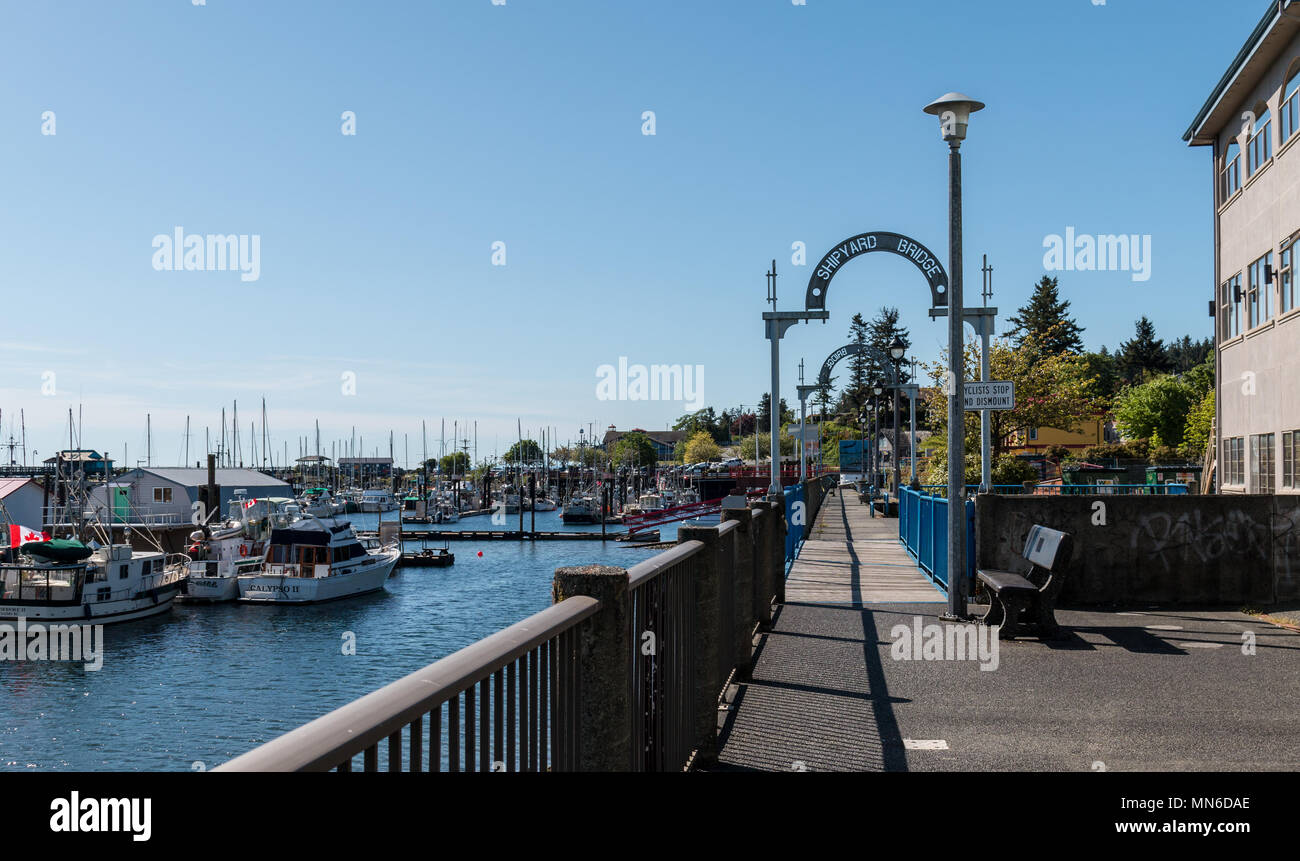 The Shipyard Bridge is part of a pedestrian walkway along the waterfront in Campbell River, BC. Stock Photo