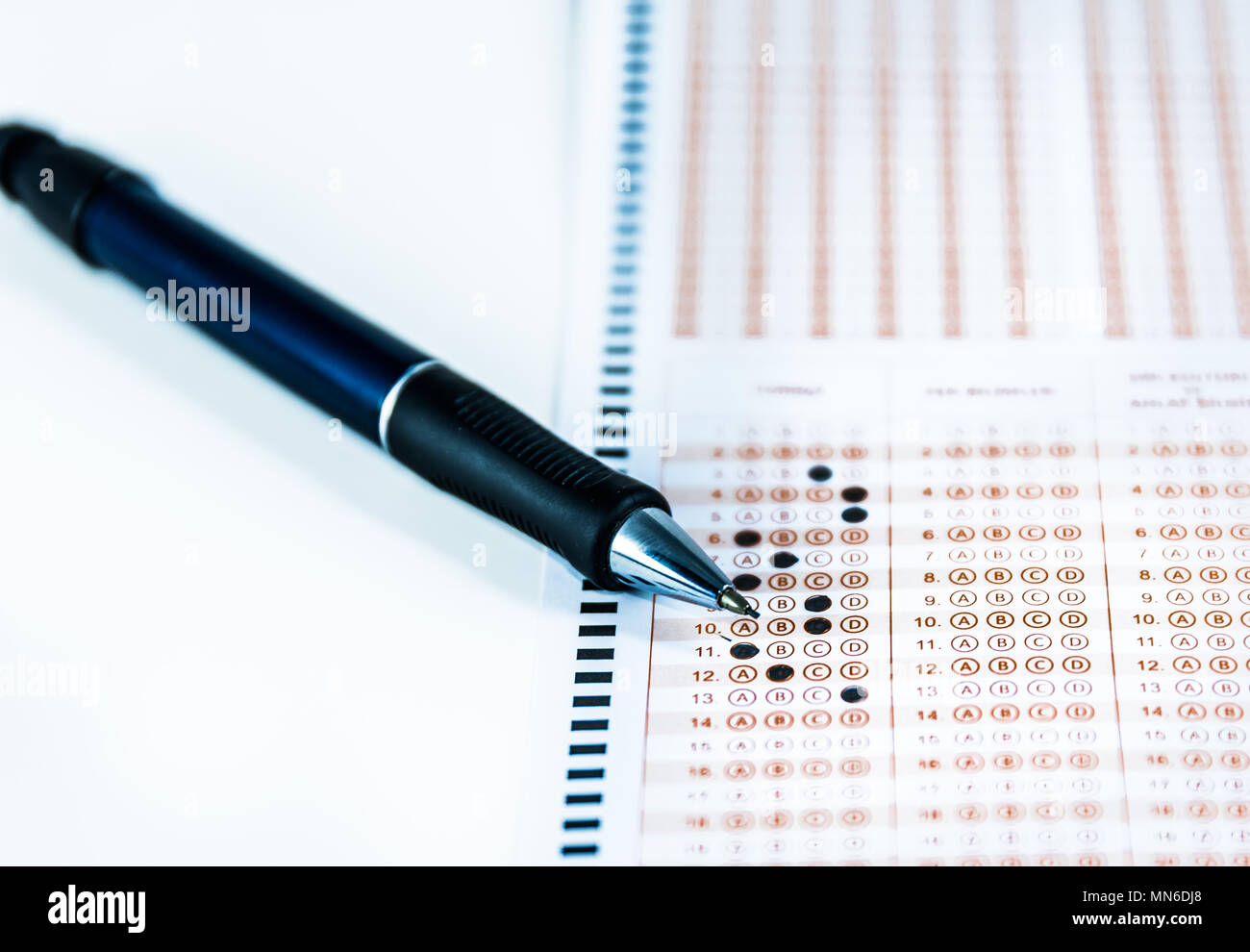 Pencil over filled typical multiple choice answer sheet.copy space for text. Stock Photo