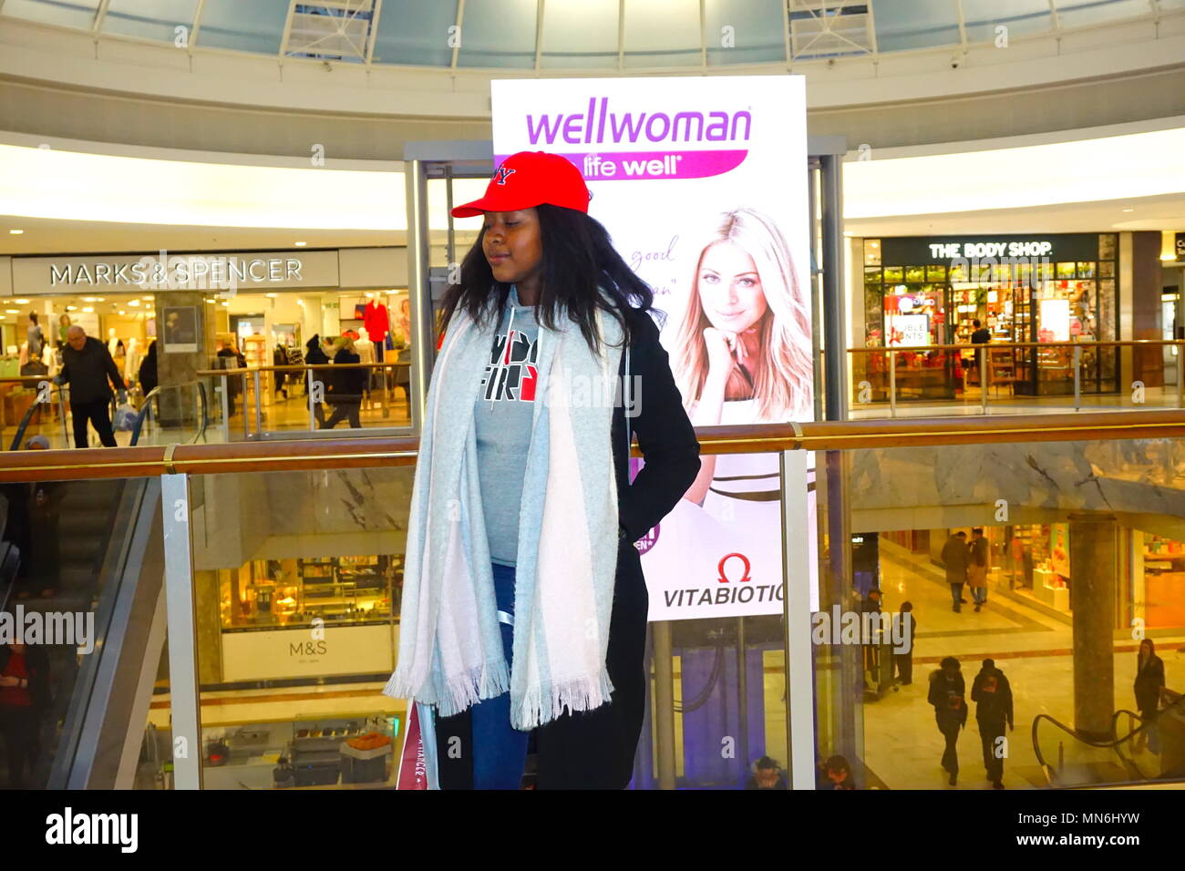 Young AfroCaribbean girl posing at Brent Cross shopping centre in