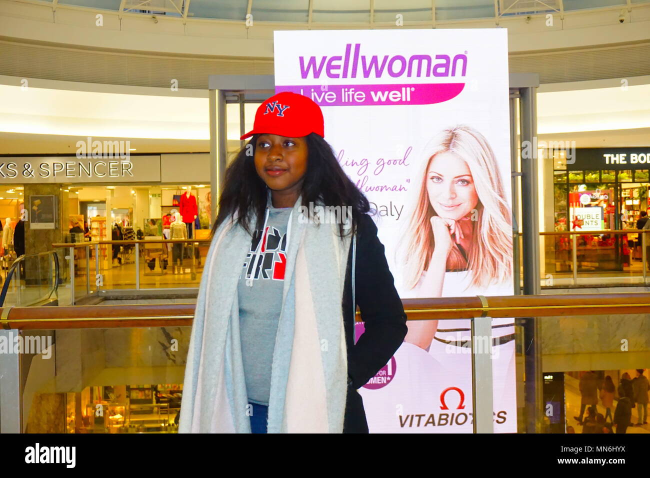 Young AfroCaribbean girl posing at Brent Cross shopping centre in