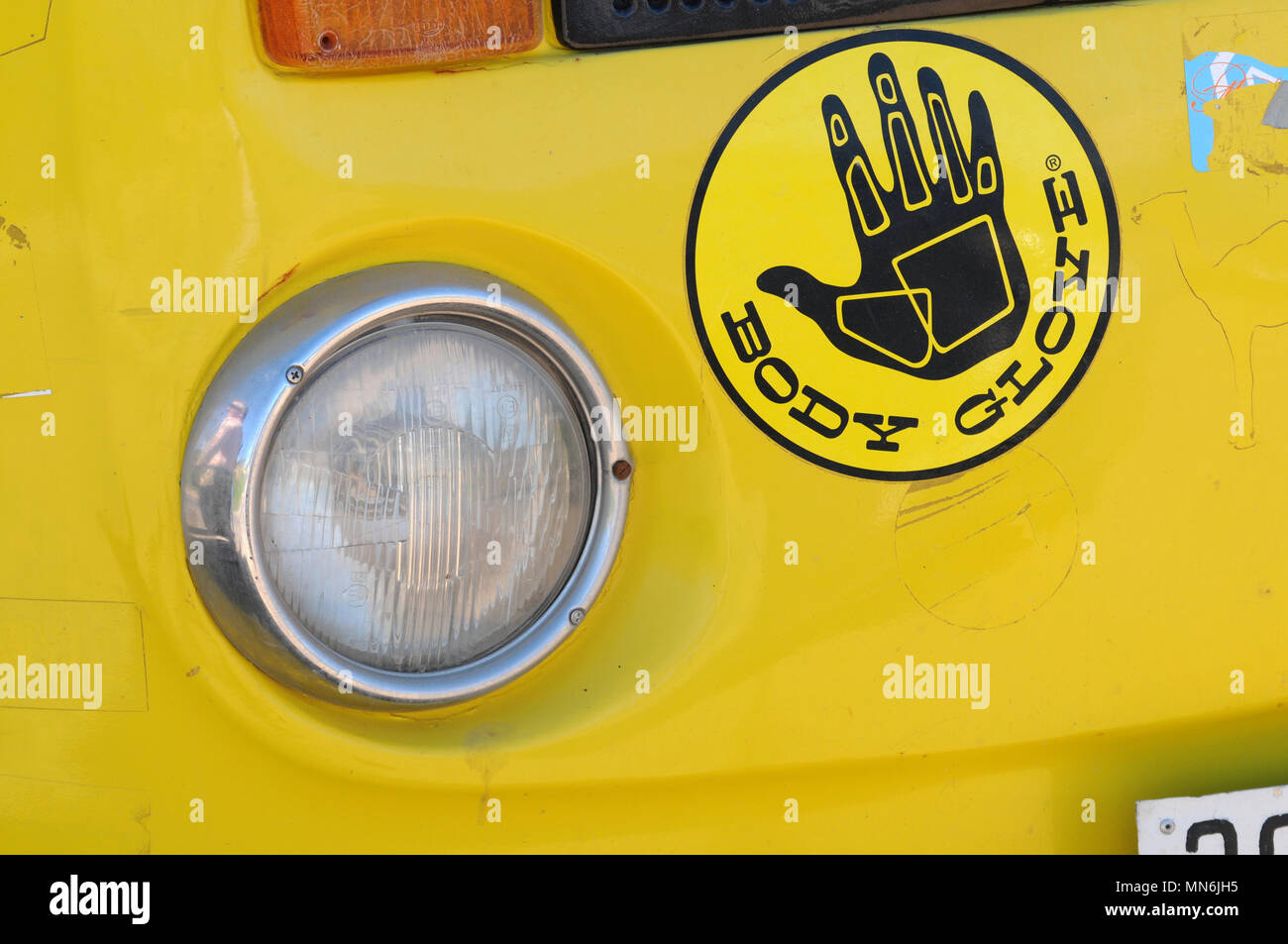 VW camper van with body glove surf sticker on it Stock Photo