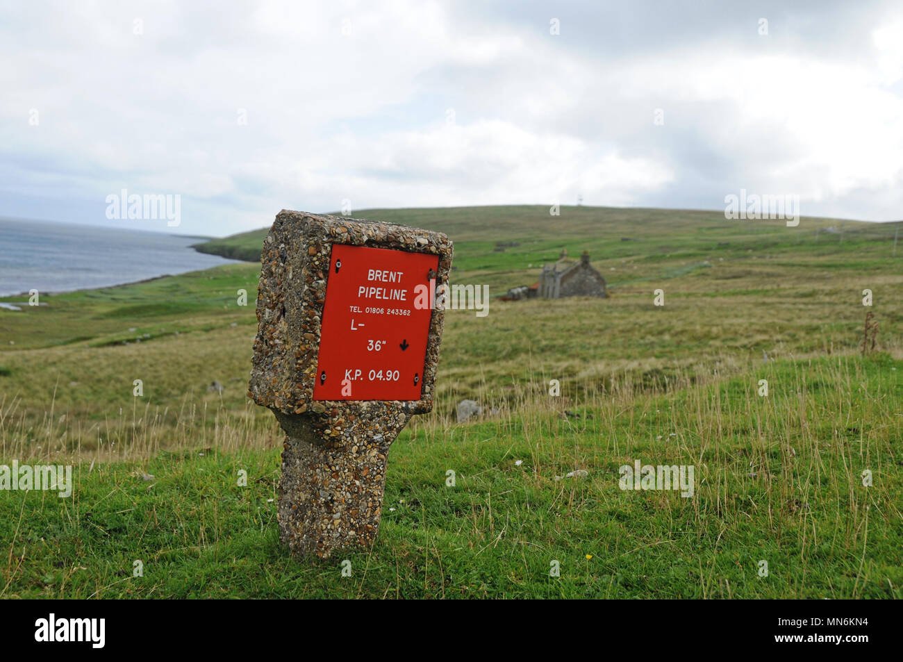Marker for landfall of pipeline for Brent Crude Oil from the north sea that is processes at Sullom Voe Oil Terminal Shetland Stock Photo