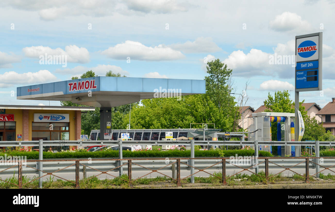 Tamoil gas station prices near Milan. Tamoil is part of Oilinvest. As of 2013 Tamoil had 2,462 service stations. Stock Photo