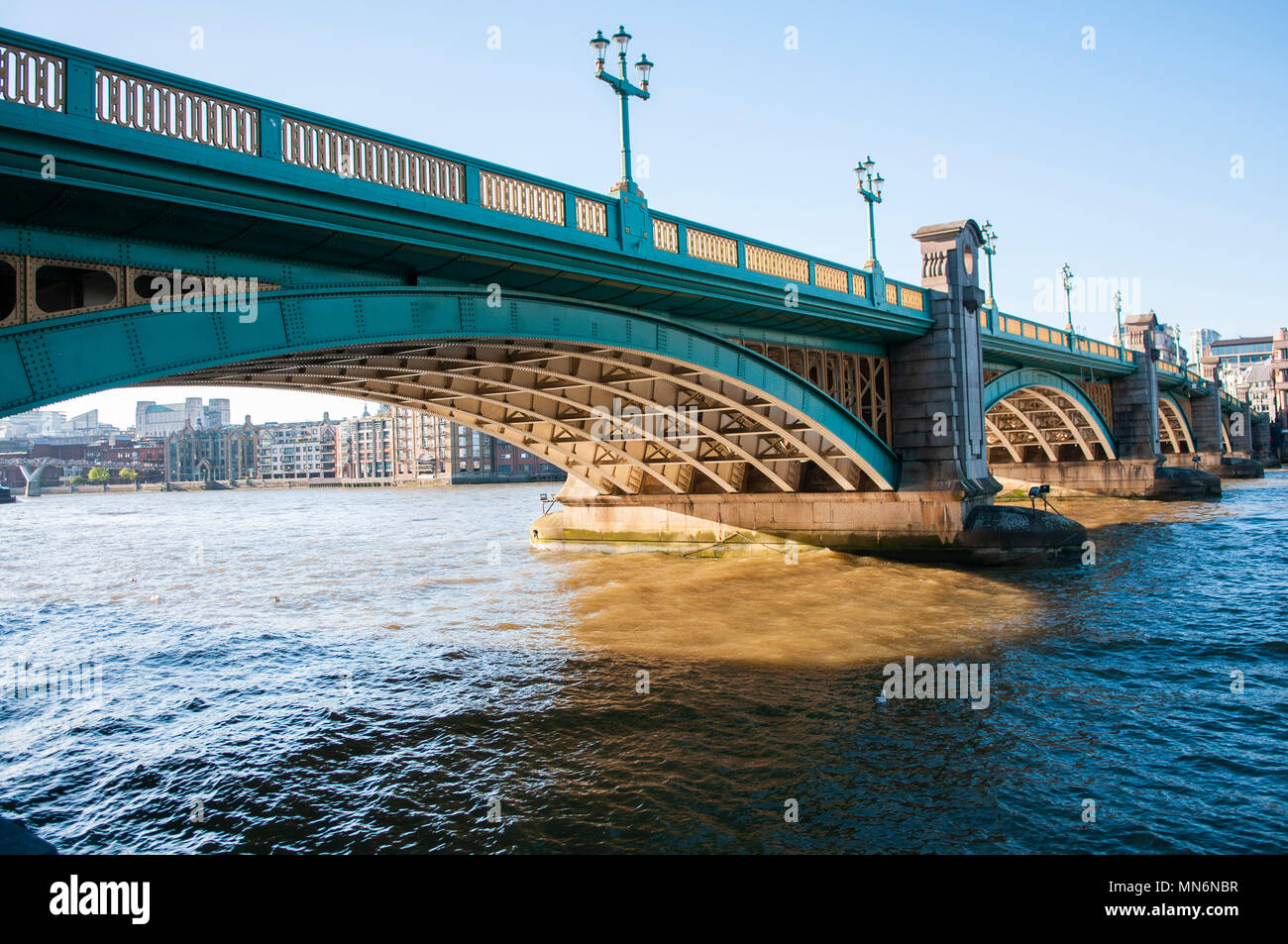 Thames flows underneath Southwark Bridge, London Stock Photo