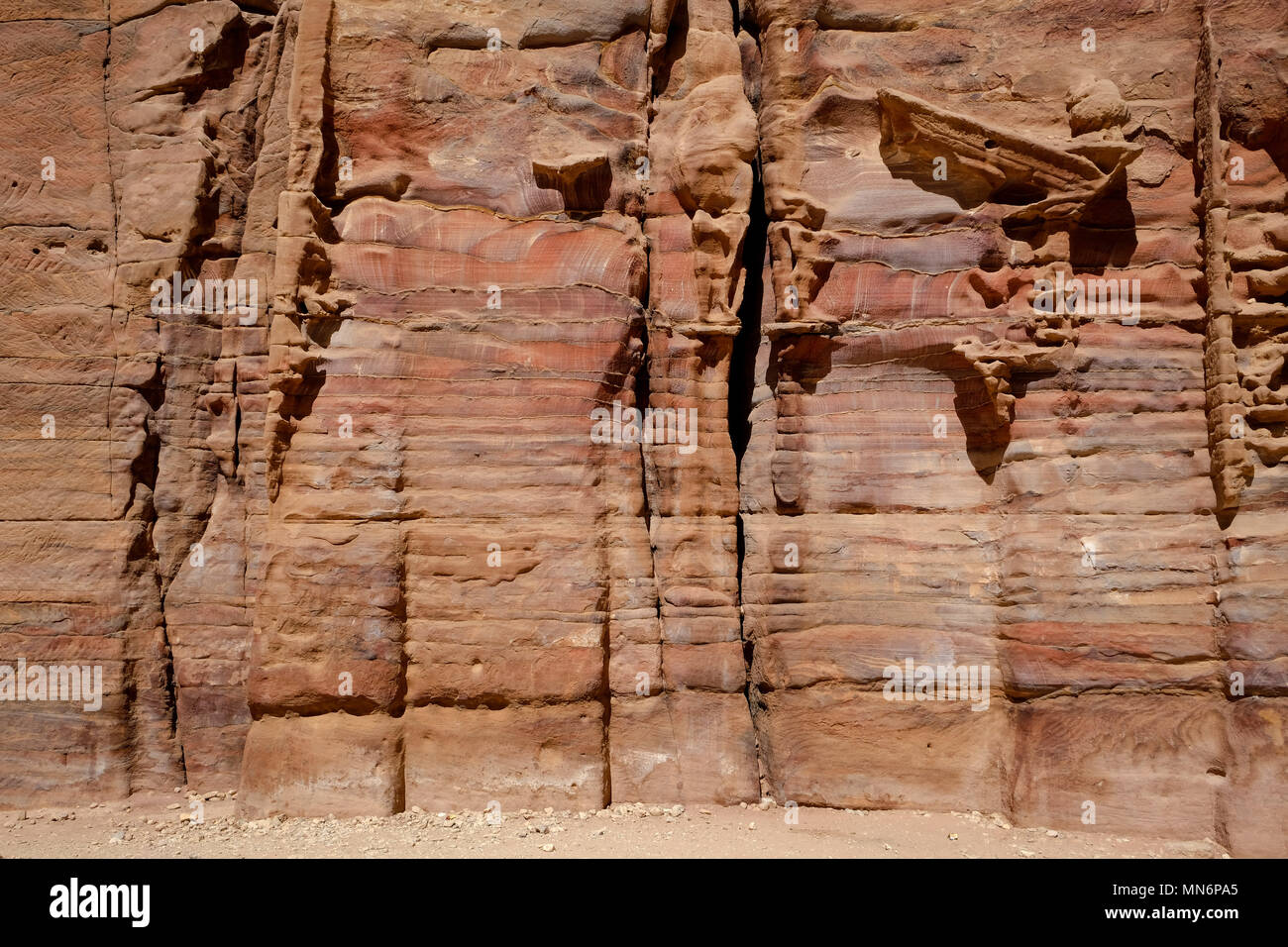 Weathered facade made by colorful sandstone wall eroded in a design in ...