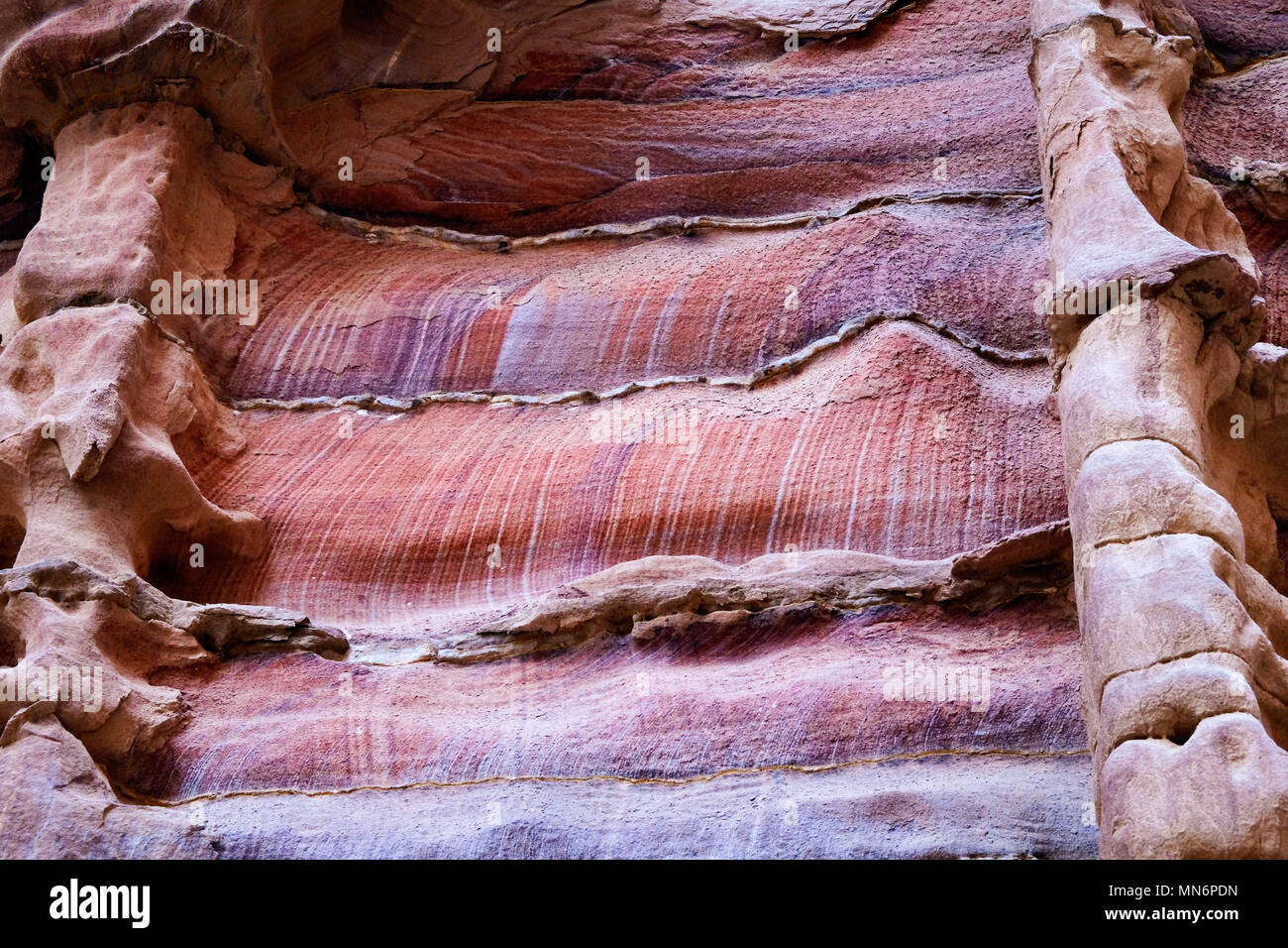 Weathered facade made by colorful sandstone wall eroded in a design in ...