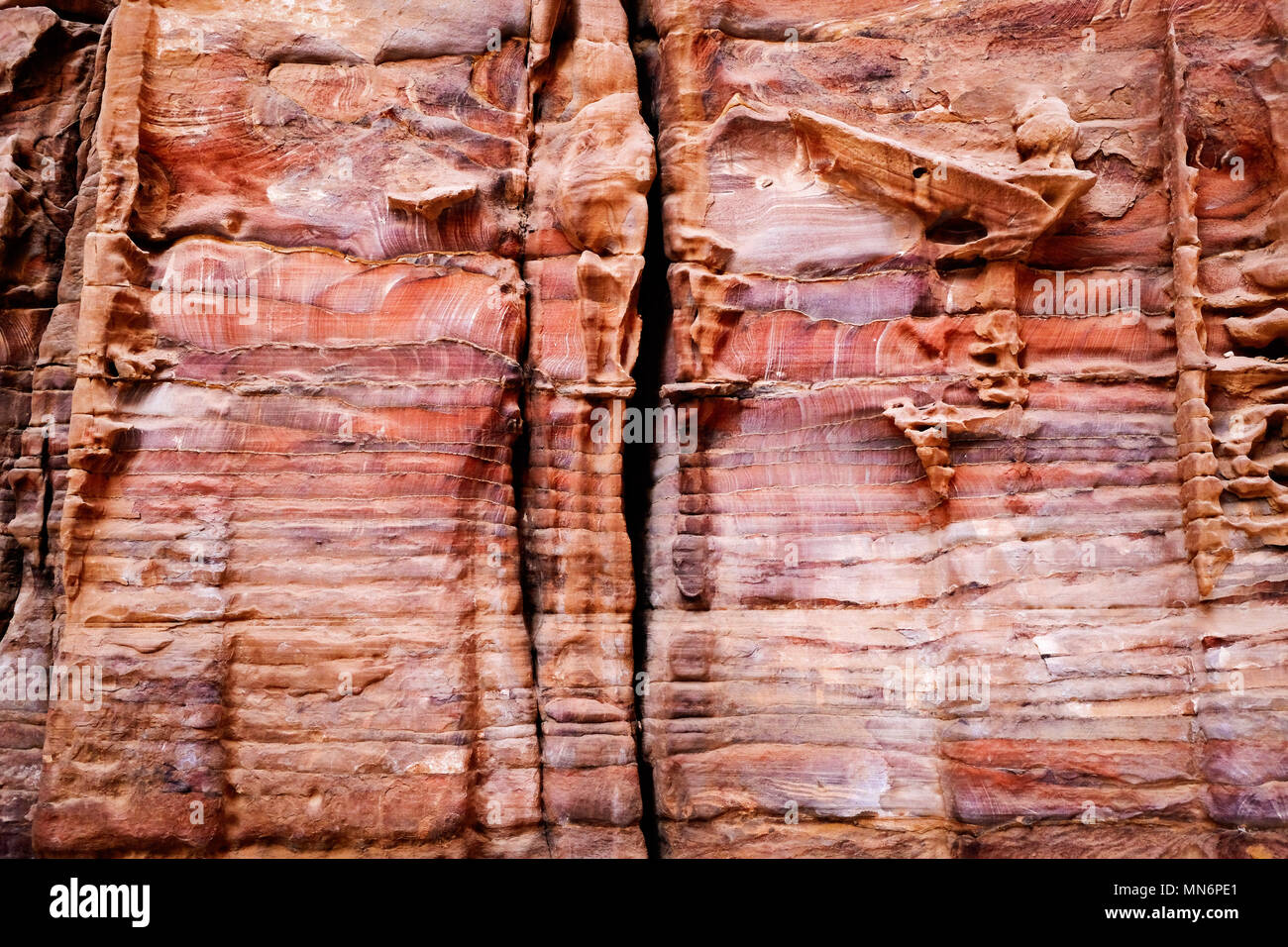 Weathered facade made by colorful sandstone wall eroded in a design in ...