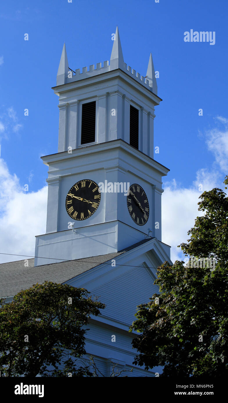 Steeple of the First United Methodist Church, Main Street, Chatham, Massachusetts, rising into a blue sky on an autumn day in New England Stock Photo