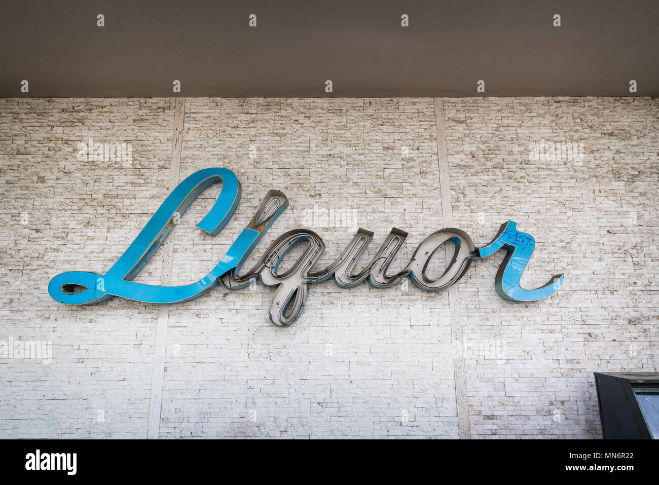 Broken neon sign that reads, 'Liquor,' in Los Angeles, California. Stock Photo
