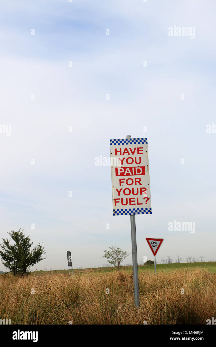Have you paid for your fuel reminder signboard at Melbourne petrol station Australia Stock Photo