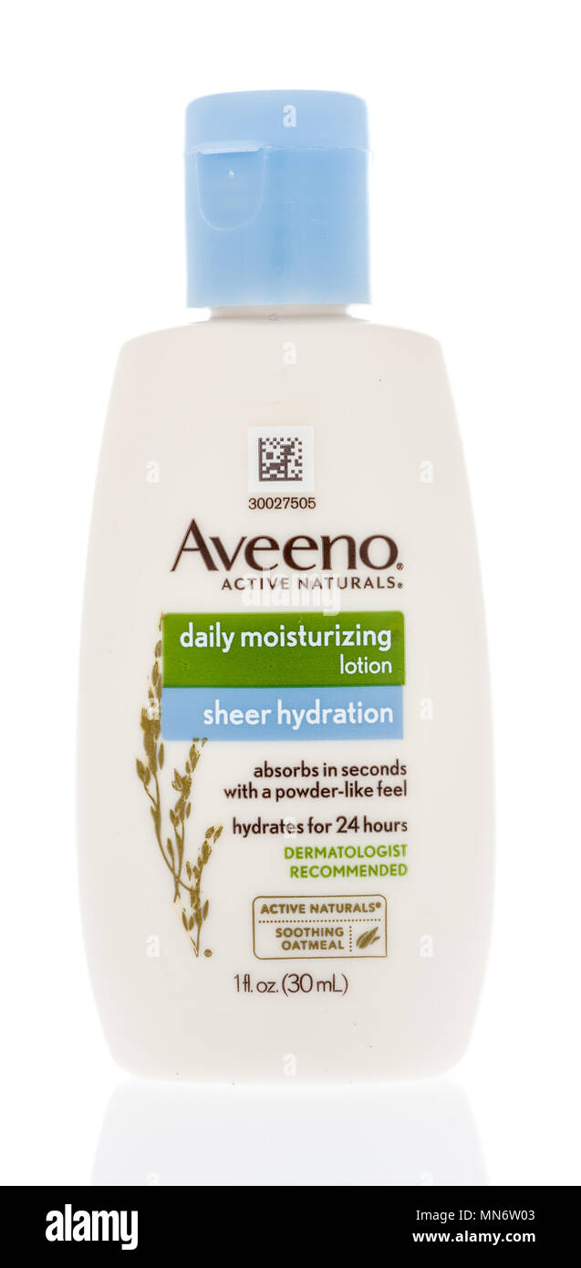 Winneconne, WI -  21 April 2018: A bottle of Aveeno daily moisturizing lotion sheer hydration on an isolated background. Stock Photo