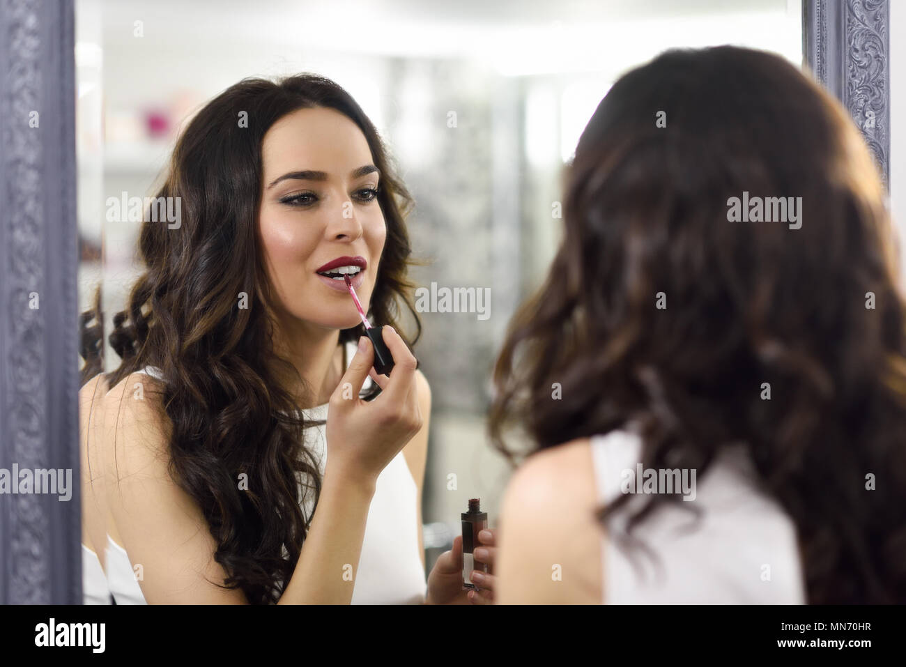 Young Brunette Woman Model Of Fashion Aplying Pink
