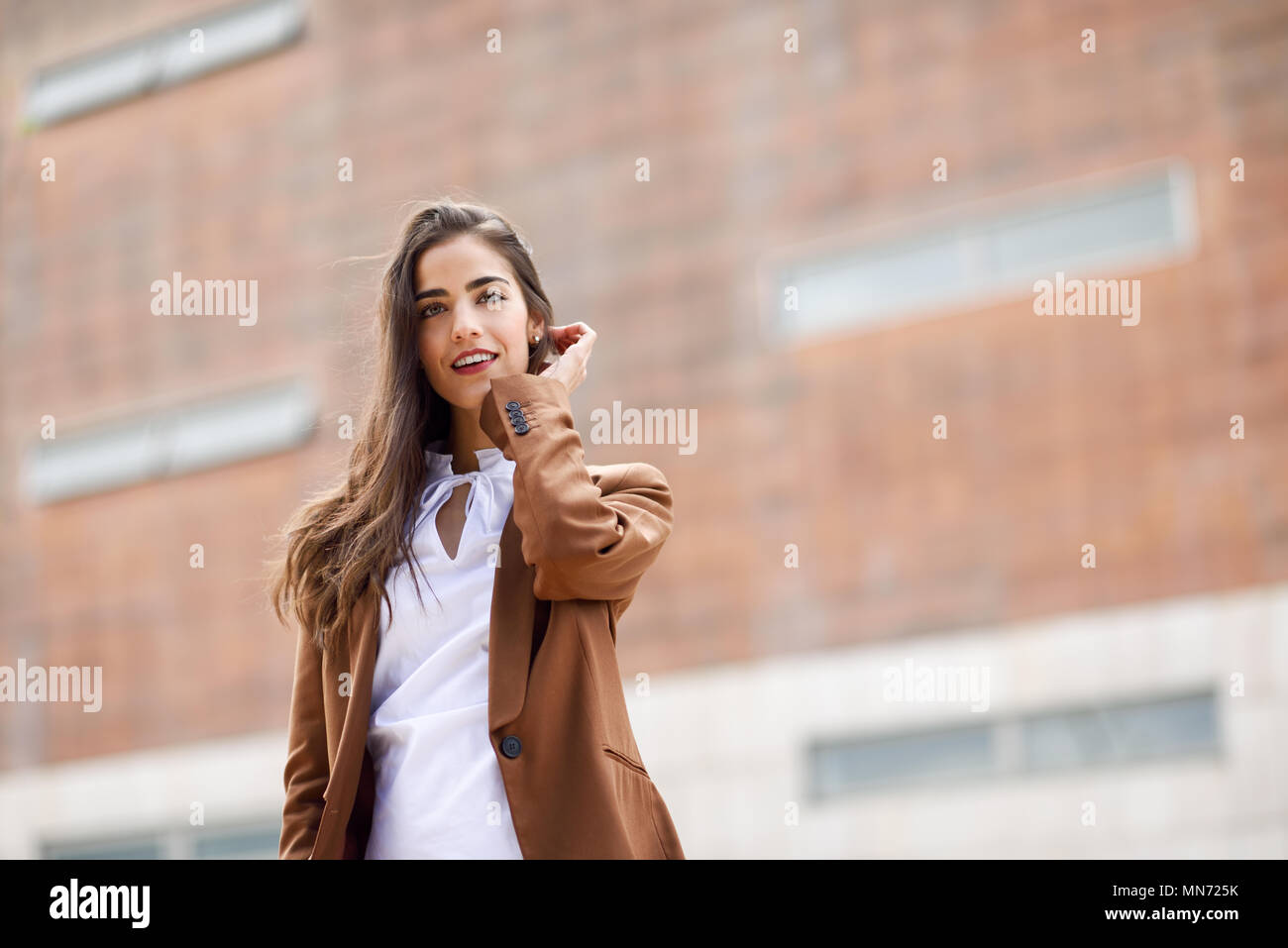 Young Woman With Nice Hair Standing Outside Of Office Building
