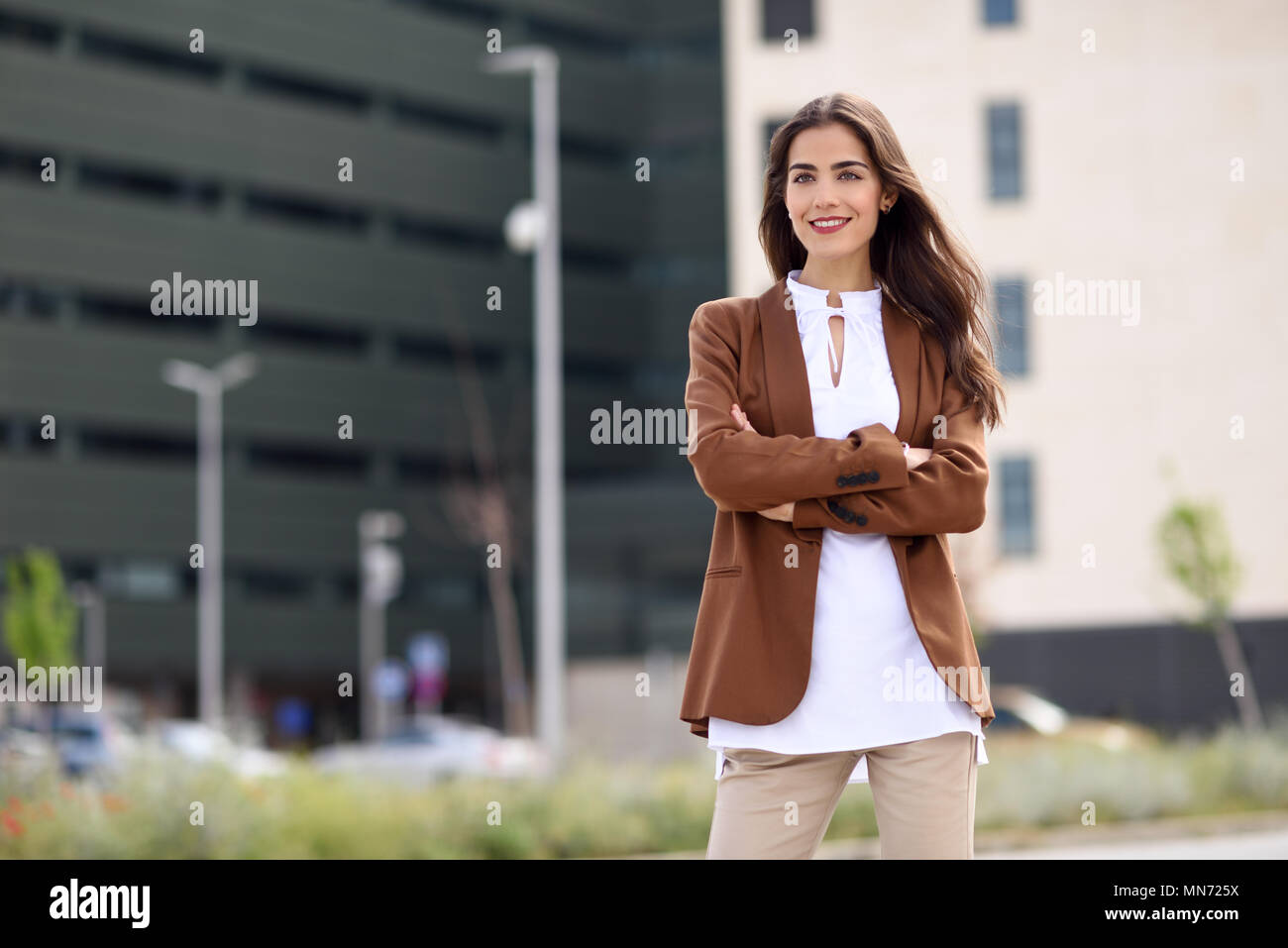 Young Woman With Nice Hair Standing Outside Of Office Building