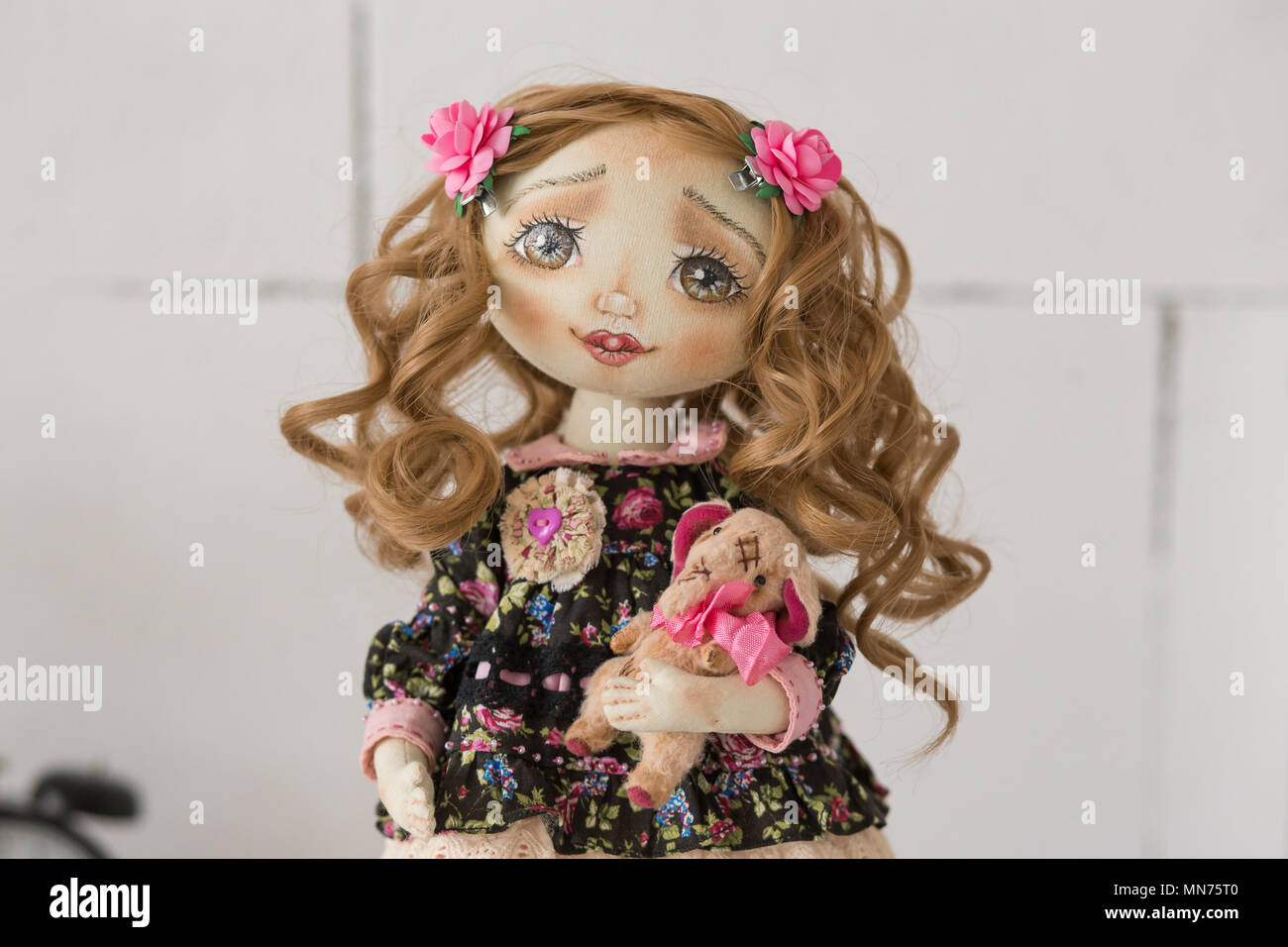 doll with brown curly hair and brown eyes