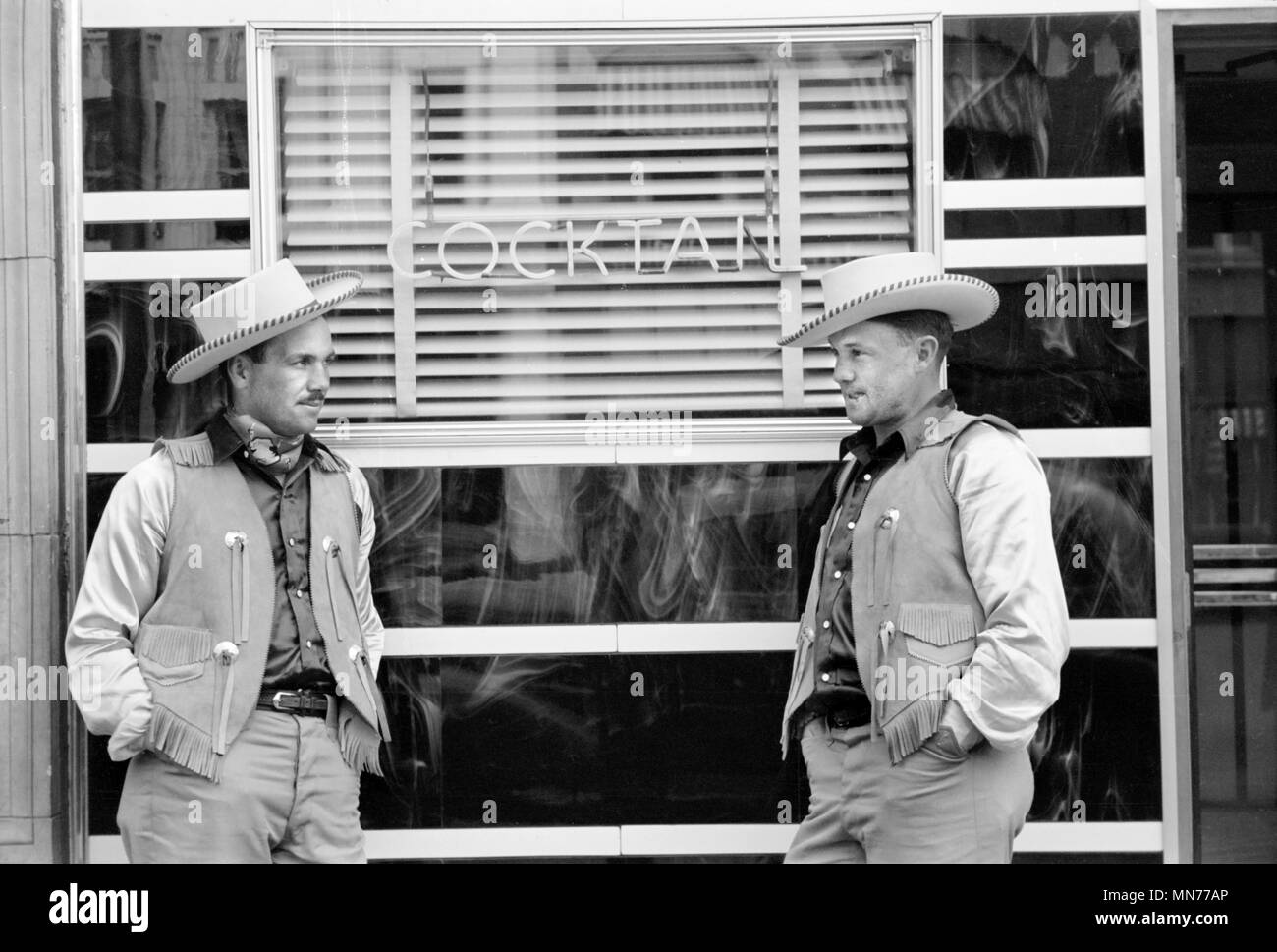 Two Cowboys Dressed Alike in Front of Bar, Billings, Montana, USA, Arthur Rothstein for Farm Security Administration, July 1939 Stock Photo