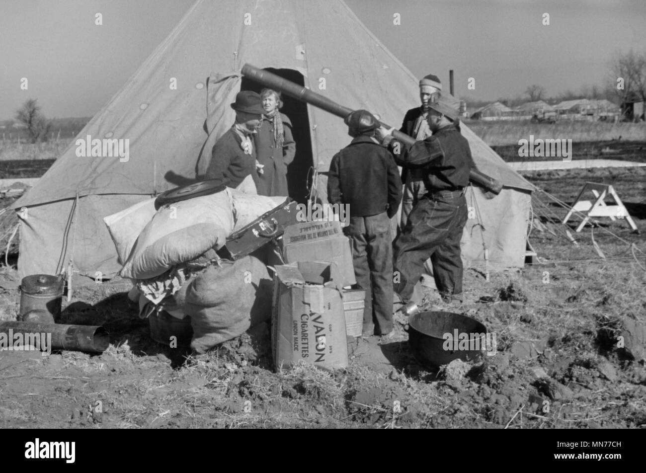 Family of Flood Refugees and their Salvaged Goods in Camp, Forrest City, Arkansas, USA, Edwin Locke for U.S. Resettlement Administration, February 1937 Stock Photo