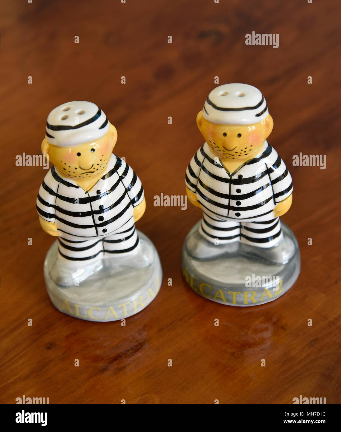 pair of salt and pepper shakers in the form of prisoners with striped