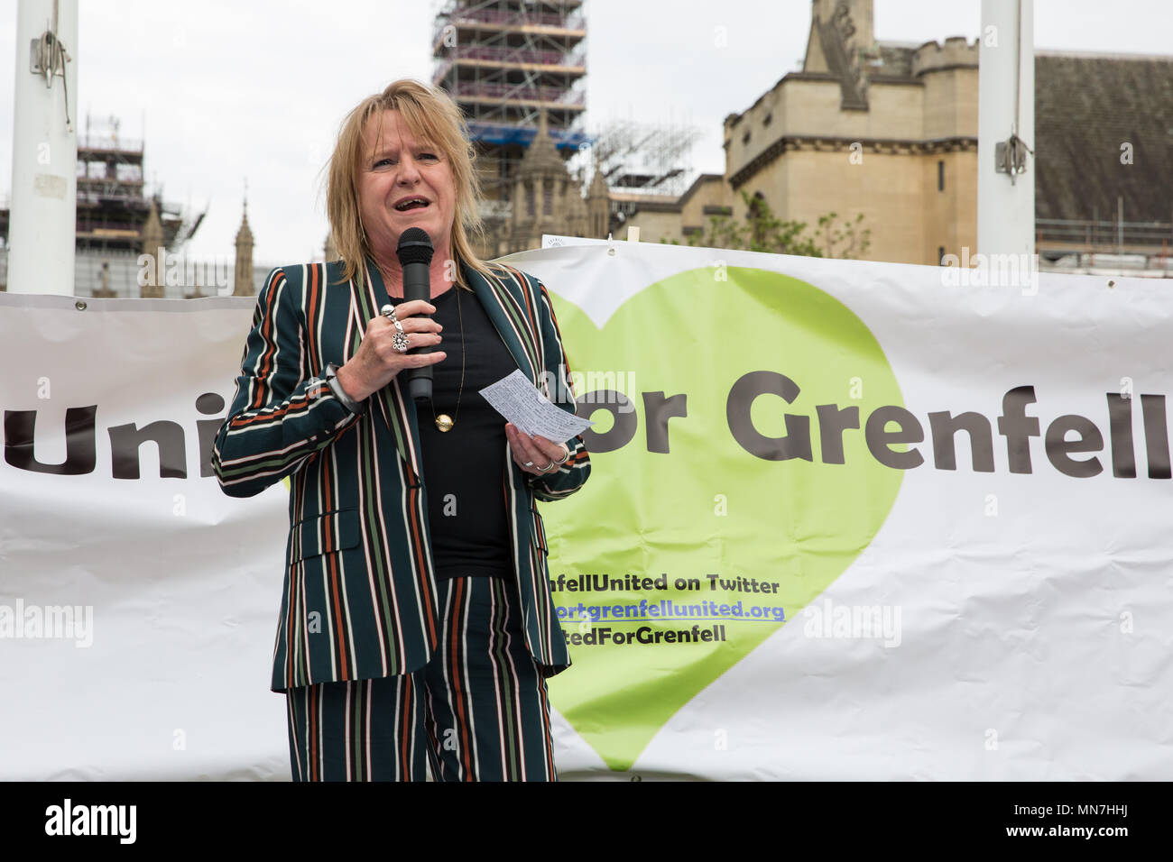 London, UK. 14th May, 2018. Deborah Cole of Inquest addresses Grenfell United Survivors, bereaved families and the community of Grenfell at a rally outside the Houses of Parliament on the 11th anniversary of the fire to urge the Prime Minister to accept their petition to appoint a panel of decision making experts to sit alongside Sir Martin Moore-Bick in the Grenfell Tower Public Inquiry.  The rally was timed to coincide with the debating of the petition in Parliament. Credit: Mark Kerrison/Alamy Live News Stock Photo