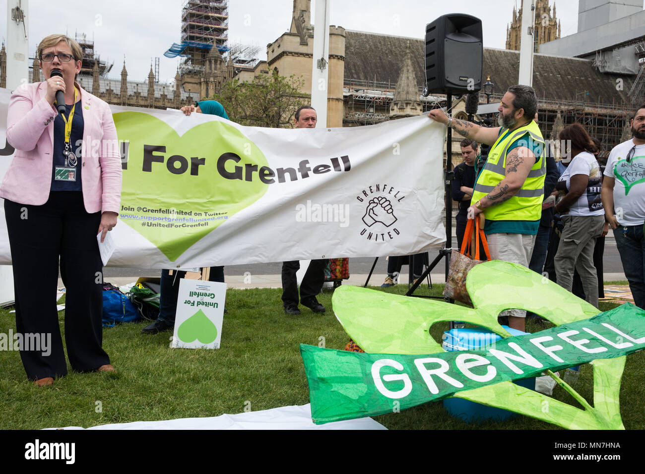 London, UK. 14th May, 2018. Joanna Cherry QC, SNP MP for Edinburgh South West, addresses Grenfell United Survivors, bereaved families and the community of Grenfell at a rally outside the Houses of Parliament on the 11th anniversary of the fire to urge the Prime Minister to accept their petition to appoint a panel of decision making experts to sit alongside Sir Martin Moore-Bick in the Grenfell Tower Public Inquiry.  The rally was timed to coincide with the debating of the petition in Parliament. Credit: Mark Kerrison/Alamy Live News Stock Photo
