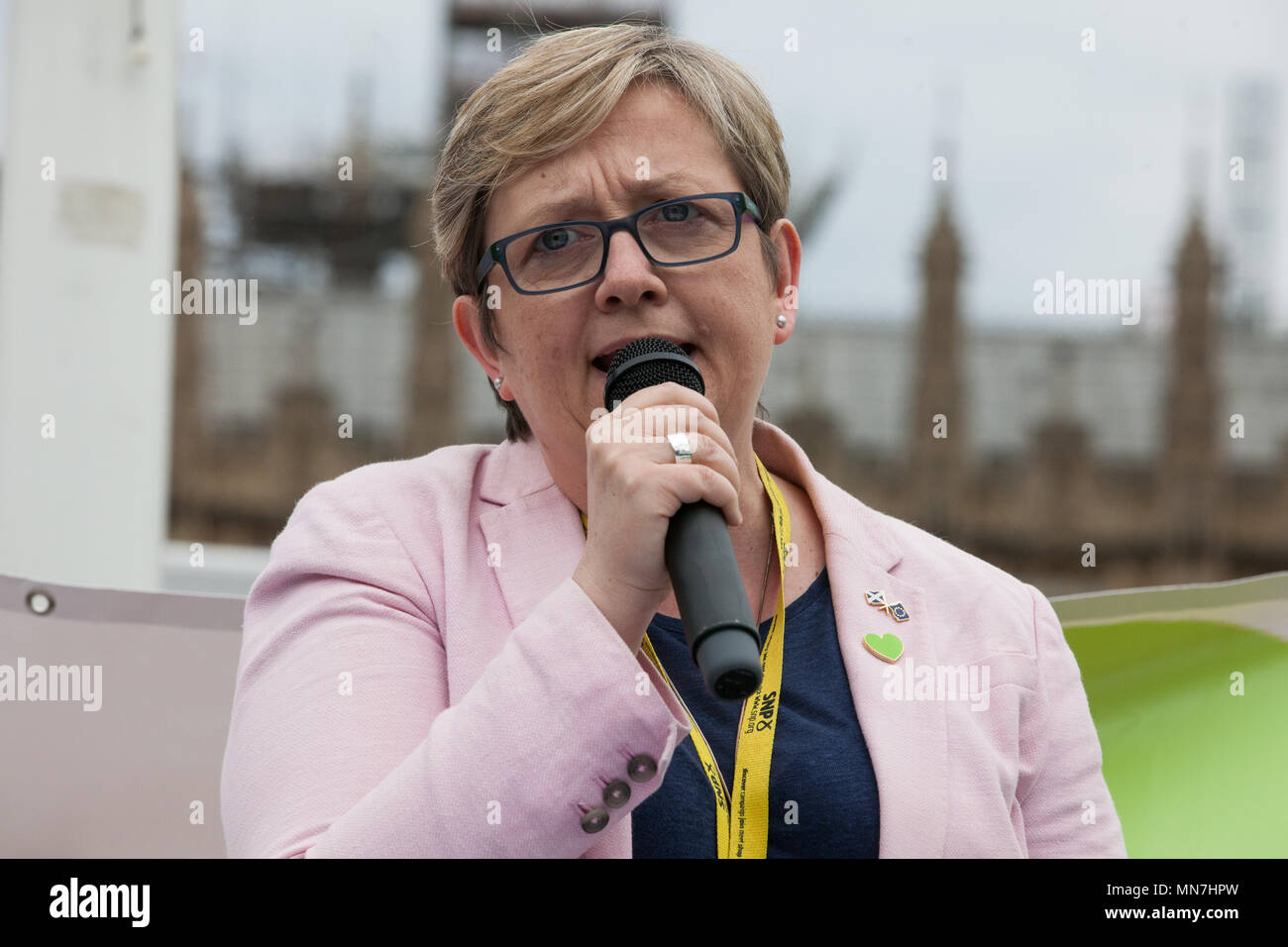 London, UK. 14th May, 2018. Joanna Cherry QC, SNP MP for Edinburgh South West, addresses Grenfell United Survivors, bereaved families and the community of Grenfell at a rally outside the Houses of Parliament on the 11th anniversary of the fire to urge the Prime Minister to accept their petition to appoint a panel of decision making experts to sit alongside Sir Martin Moore-Bick in the Grenfell Tower Public Inquiry.  The rally was timed to coincide with the debating of the petition in Parliament. Credit: Mark Kerrison/Alamy Live News Stock Photo