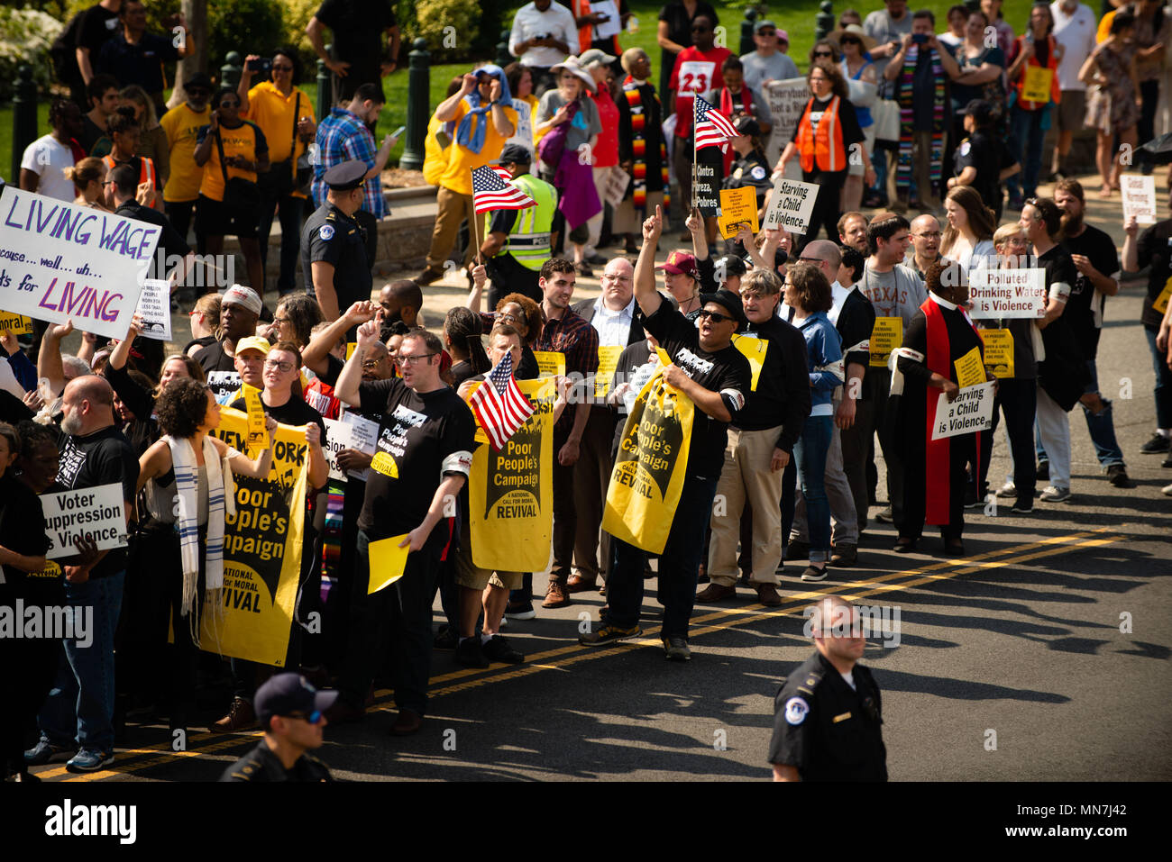 Washington, DC, USA. 14th May, 2018. Marchers at the start of a new Poor People's Campaign run into a police block and wait to be arrested near the U.S. Capitol in Washington, DC. The campaign, modeled after a similarly named campaign by the Rev. Dr. Martin Luther King 50 years earlier, began with rallies in about three dozen states, and is planned to last six weeks. Approximately 200 people were arrested in the various rallies, often being cited for blocking traffic. Credit: Jay Mallin/ZUMA Wire/Alamy Live News Stock Photo