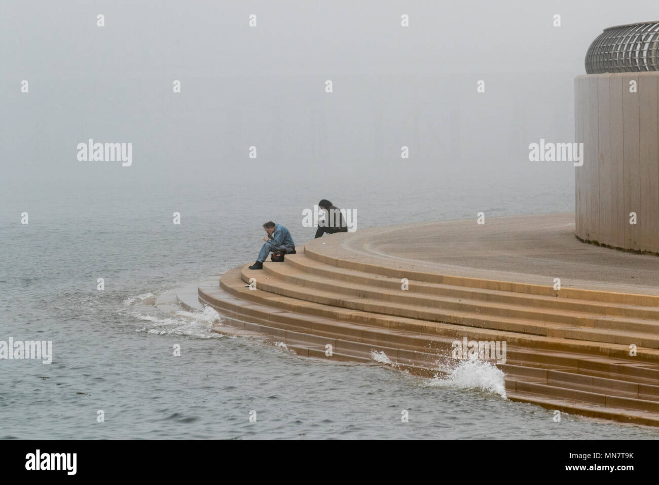 Blackpool, Lancashire. Uk Weather. 15/05/2018. Chilly, hazy and foggy start to the day on the Fylde Coast as seafret or har rolls in off the Irish Sea. Credit: MediaWorldImages/Alamy Live News Stock Photo