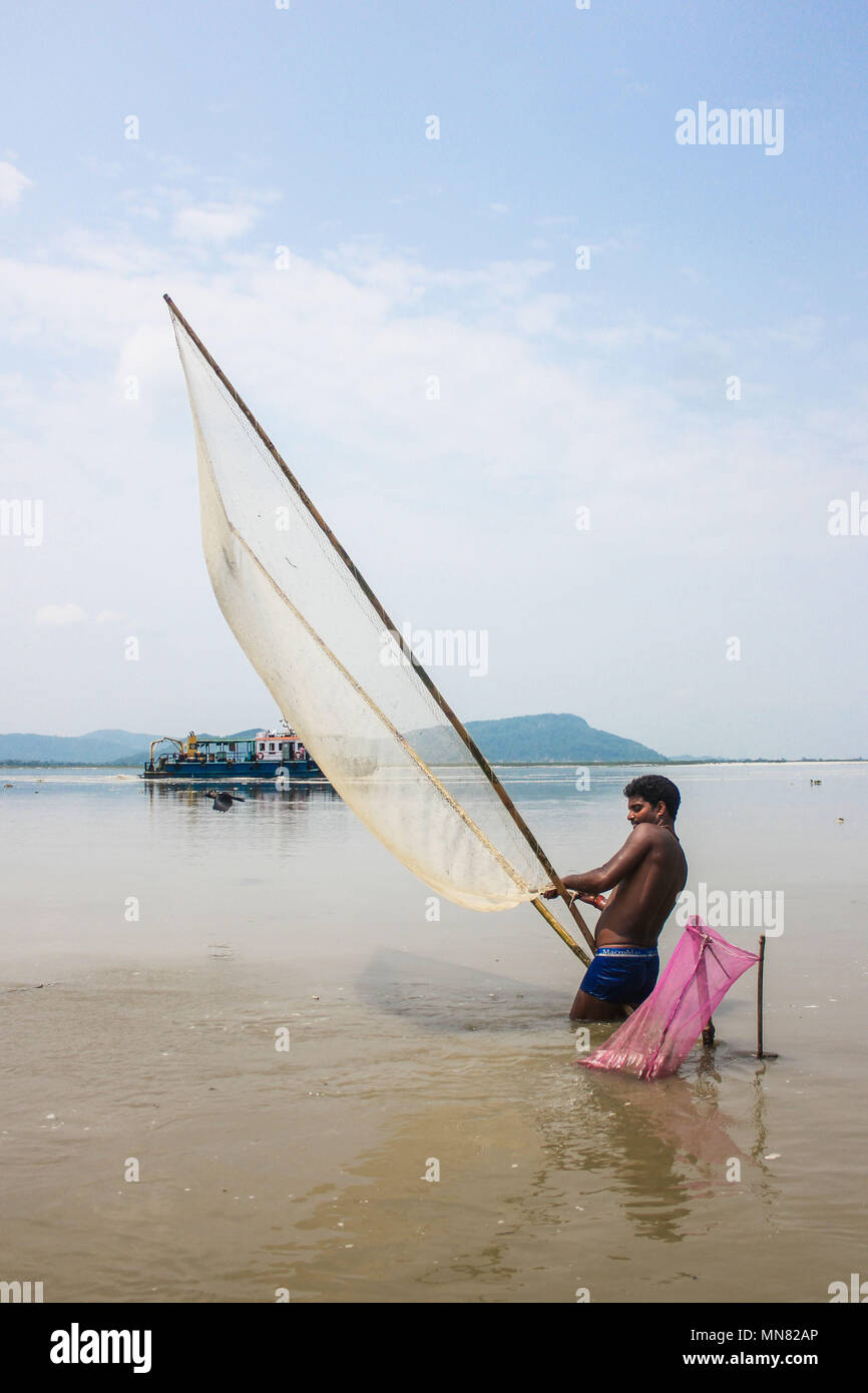 Guwahati, India. 14th May, 2018. An Indian man fishing in the bank of river Brahmaputra at