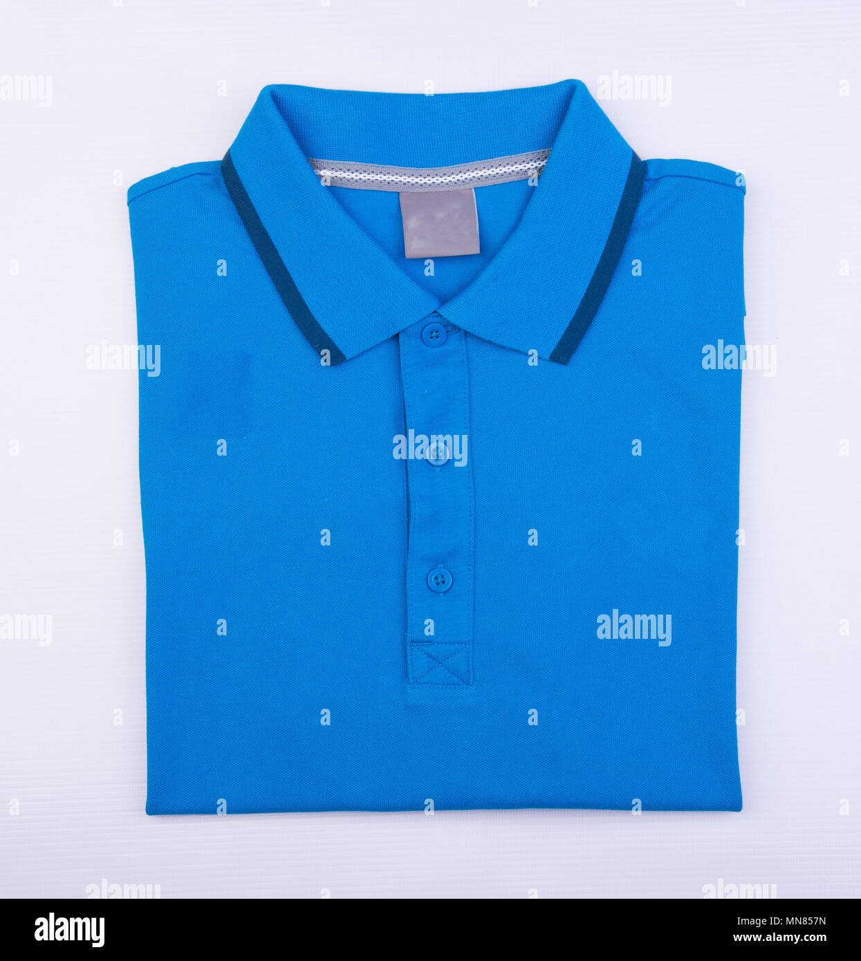 shirt or mens folded polo shirt on background Stock Photo - Alamy
