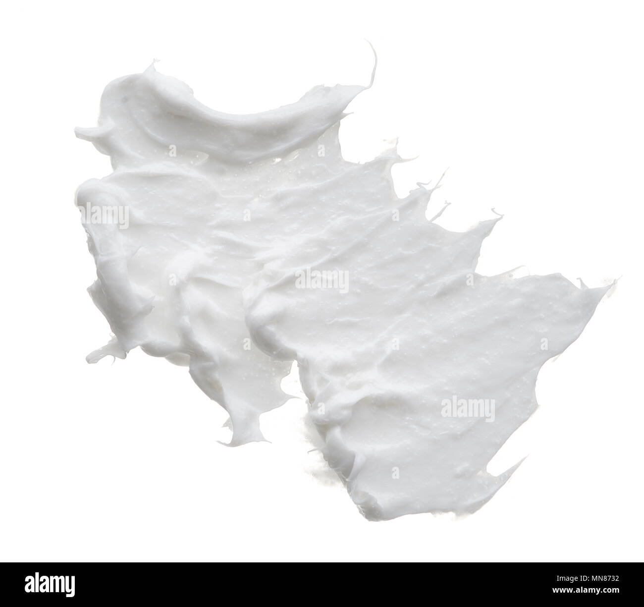 White creamy texture isolated on white background. Smear of face cream