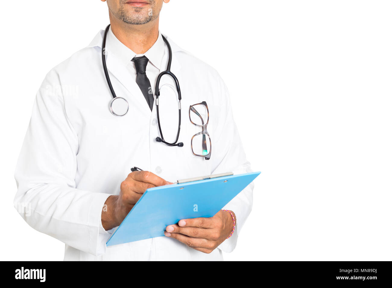 Close up of male medicine doctor writing on clipboard isolated on white background . Medical and healthcare concept Stock Photo
